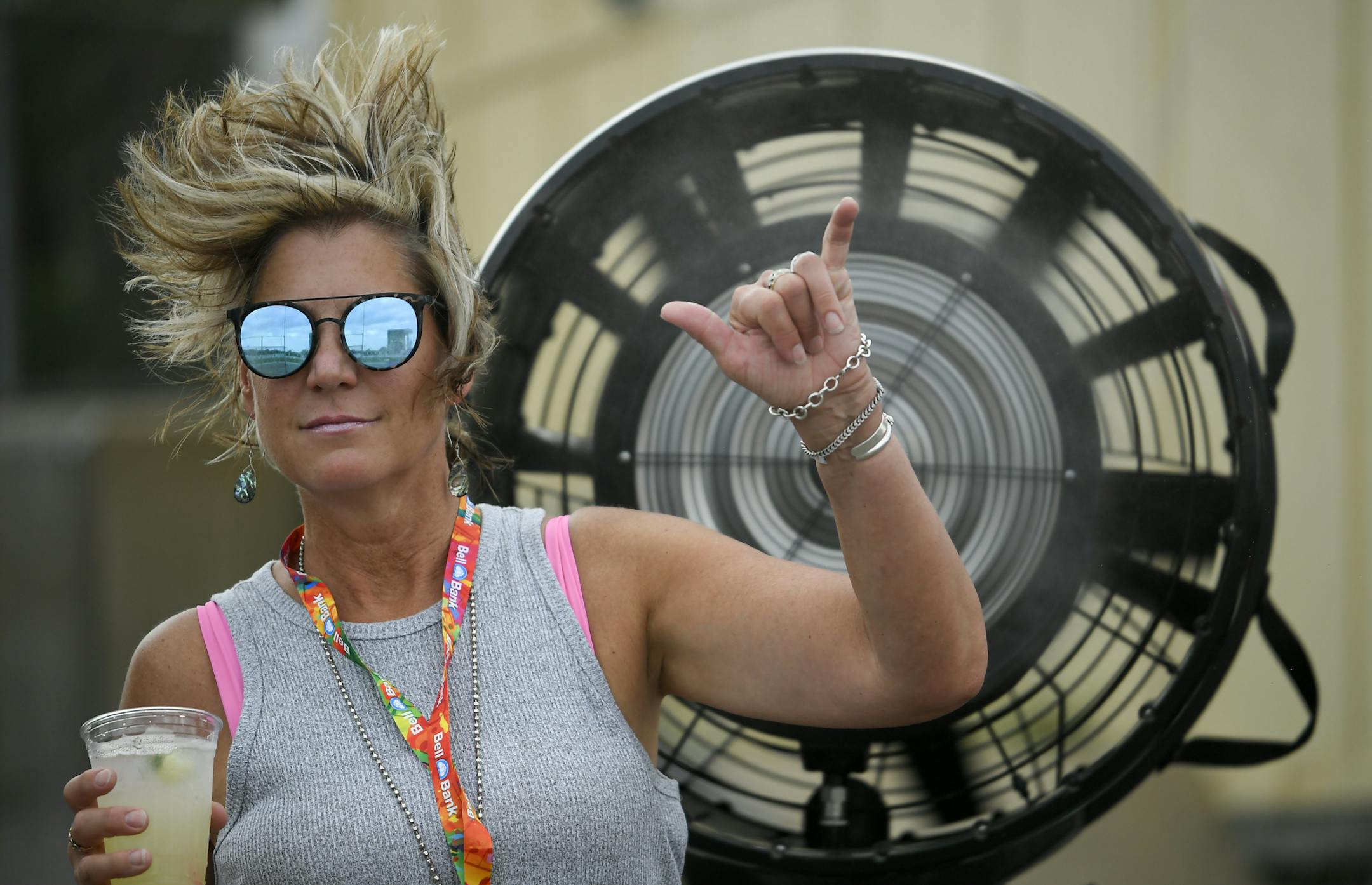 Suzie Dahl, of Lakeville, gestured to the camera as she stood by a mister fan at the Twin Cities Summer Jam Festival Friday. ] Aaron Lavinsky ¥ aaron.lavinsky@startribune.com The second day's of the Twin Cities Summer Jam Festival was held Friday, July 19, 2019 at Canterbury Park in Shakopee, Minn.