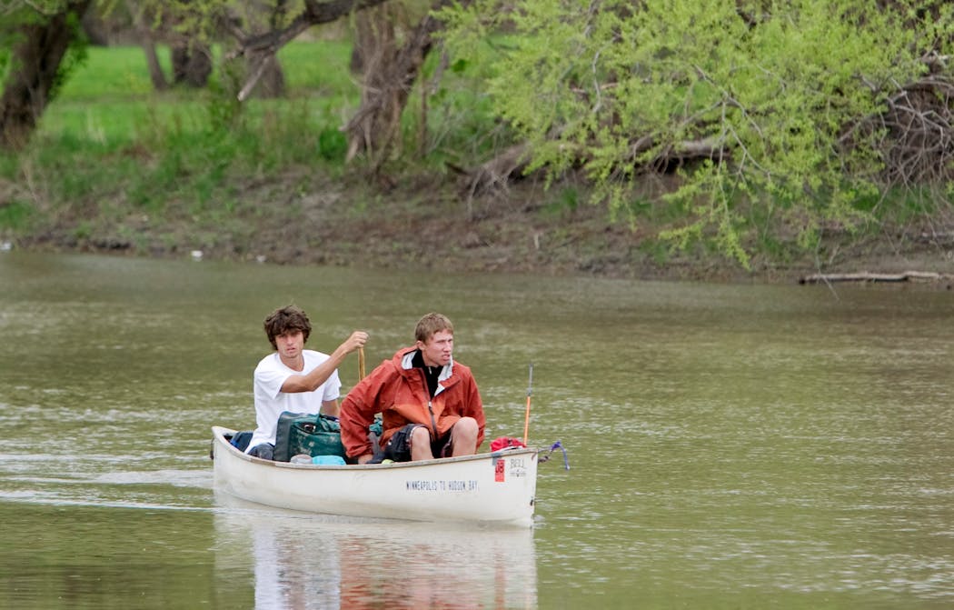 Eighteen-year-olds Sean Bloomfield, left, and Colton Witte, both of Chaska, arrived May 19, 2008, at the mid-town dam between Fargo, N.D., and Moorhead, Minn., on their journey from Chaska to Hudson Bay by canoe.