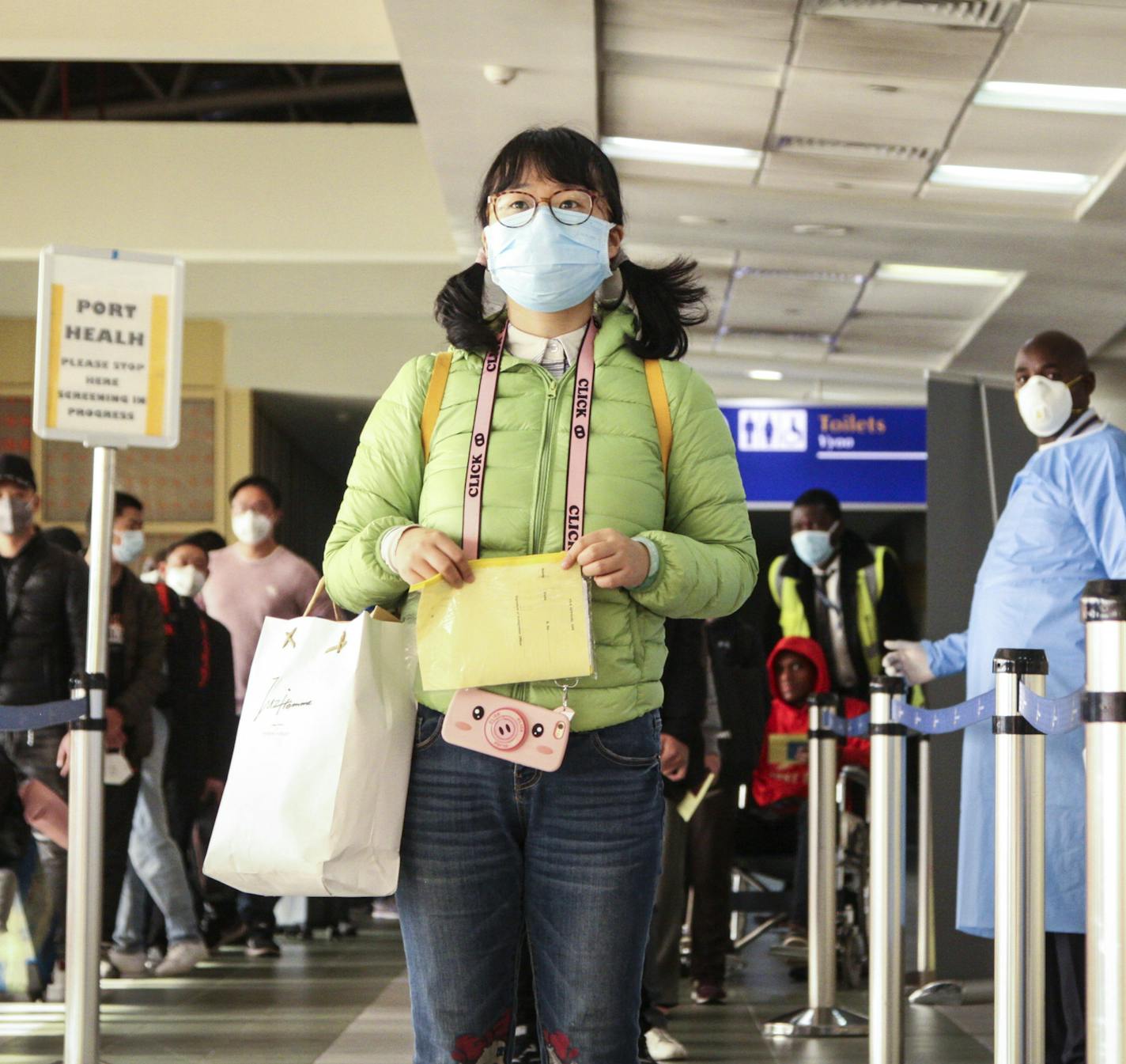 Passengers arriving from a China Southern Airlines flight from Changsha in China are screened for the new type of coronavirus, whose symptoms are similar to the cold or flu and many other illnesses, upon their arrival at the Jomo Kenyatta international airport in Nairobi, Kenya, Wednesday, Jan. 29, 2020. Some countries began evacuating their citizens Wednesday from Wuhan, the Chinese city hardest-hit by an outbreak of the new virus that is thought to have killed over one hundred people and infec