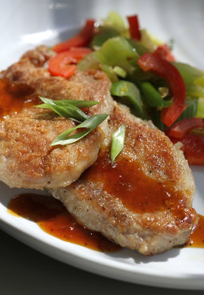 Pan-seared pork chops are topped with an easy apricot glaze that's made in the same skillet.