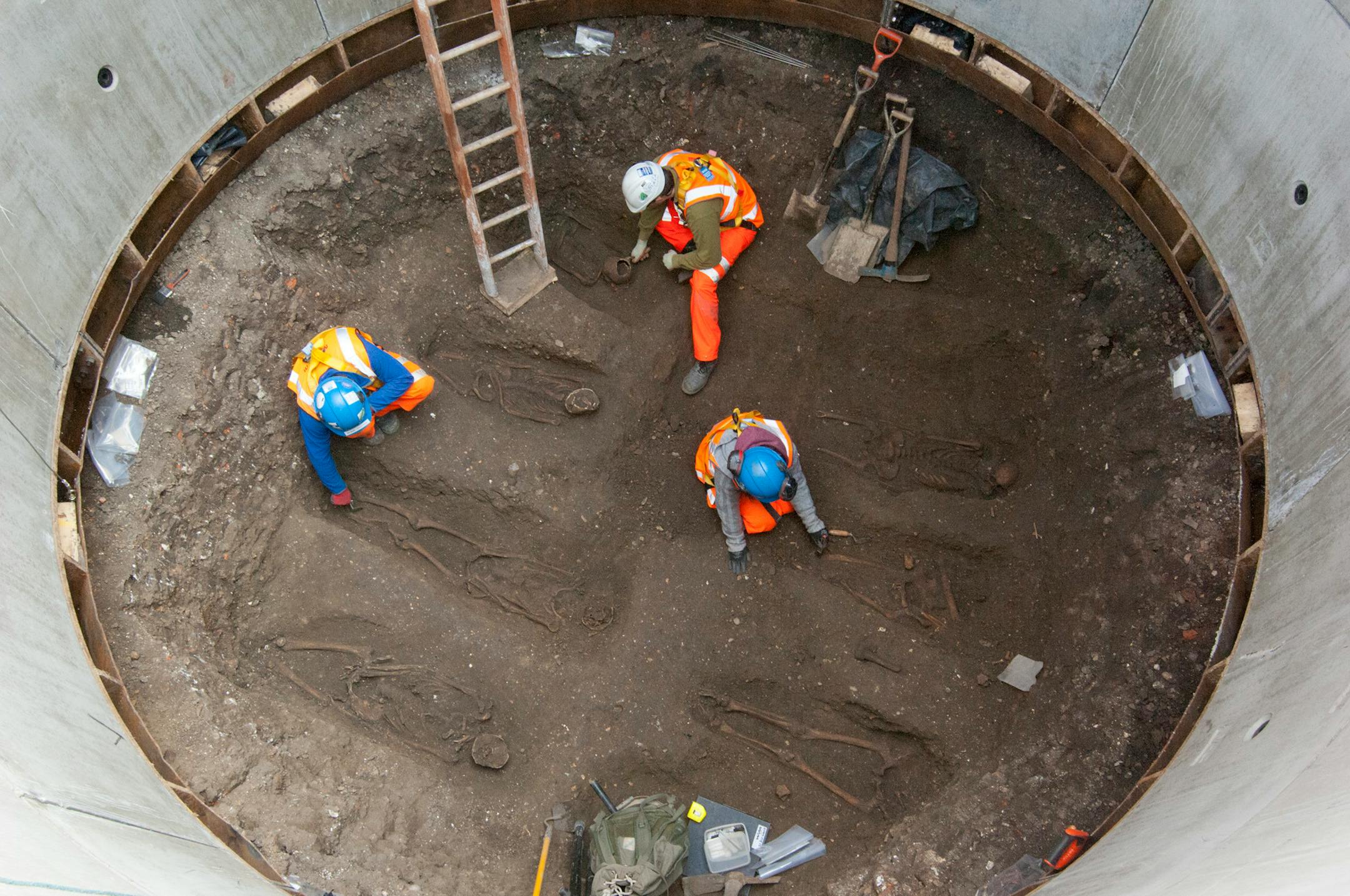 In this undated but recent photo supplied Friday March 15, 2015, by the London Crossrail Project, showing archaeologists working on the UK�s largest infrastructure project, Crossrail, as they uncover an historical burial ground at Charterhouse Square, Farringdon in central London. Scientists were called in to investigate bones found during the digging of a new railway in central London, after uncovered 13 skeletons were found. The skeletons will be tested to see if they died from the Black Death