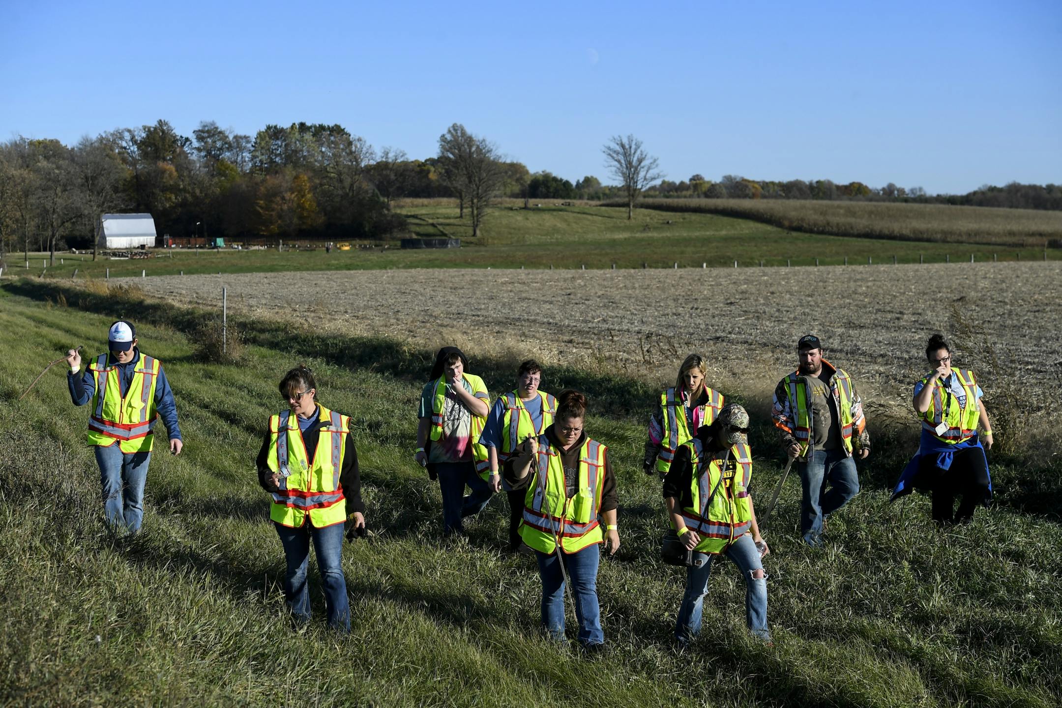 Law enforcement and volunteers searched along Highway 8 just outside Barron, Wisc., for evidence related to the disappearance of 13-year old Jayme Closs and the murder of her parents on Thursday, Oct. 18, 2018.
