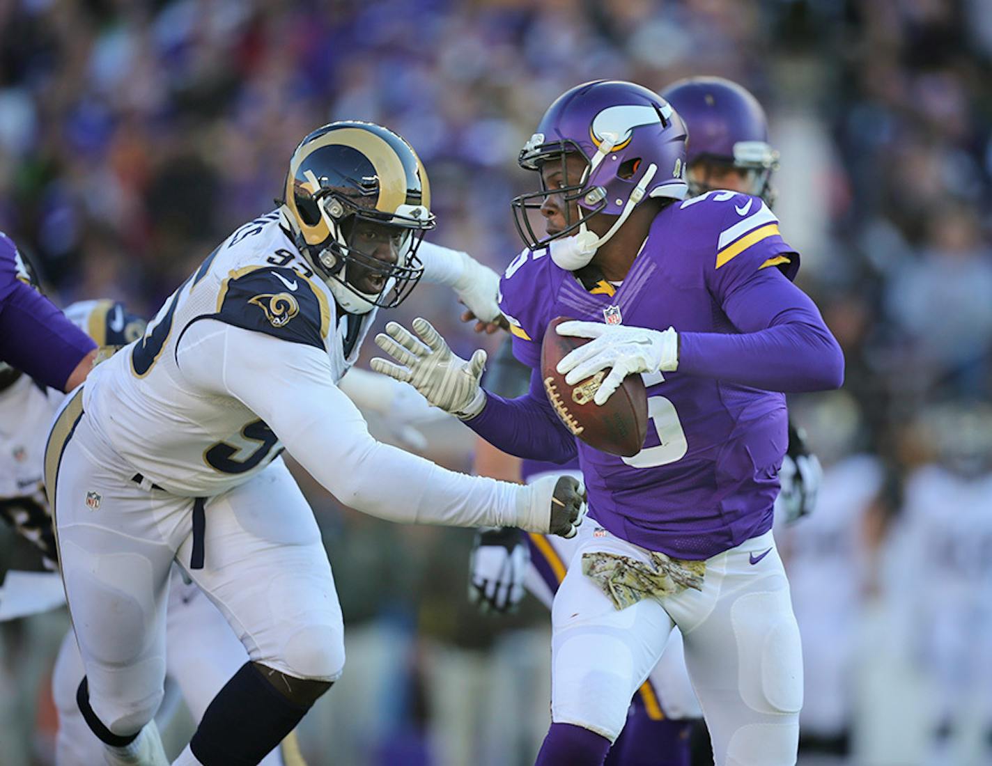 Vikings quarterback Teddy Bridgewater (5) was pursued by Rams defensive end William Hayes (95) in the third quarter Sunday afternoon. Hayes hit Bridgewater hard after he got rid of the ball.