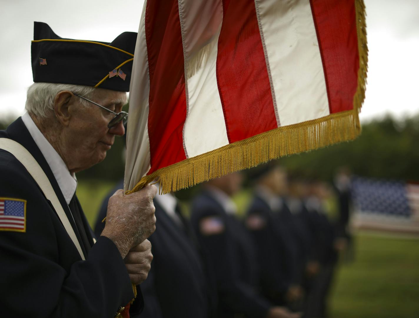 Lanny Holzer stood with other members of the Jordan Vets Honor Guard during the memorial service Thursday evening. ] JEFF WHEELER &#xef; jeff.wheeler@startribune.com Jesse Richard went through life never knowing his father. He was only a few months old when his father, Thomas Breunig, was one 13 Marines who died in a river of fire that engulfed his barracks in Japan in October 1979. On a chilly Thursday evening August 3, 2017, at Calvary Cemetery in Jordan, a second memorial service was held for