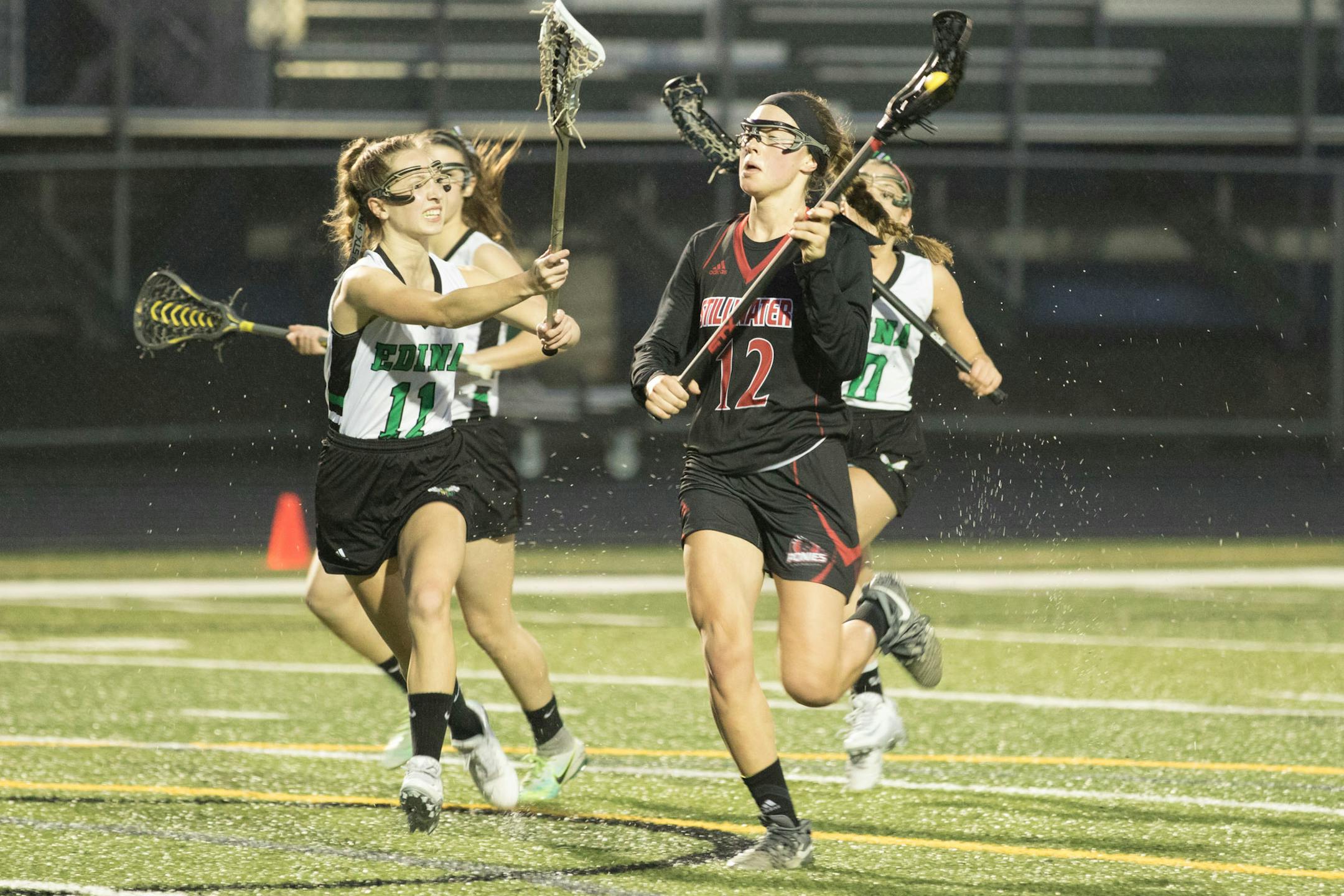 Stillwater's Olivia Konigson carried the ball downfield in a season-opening game against Edina.