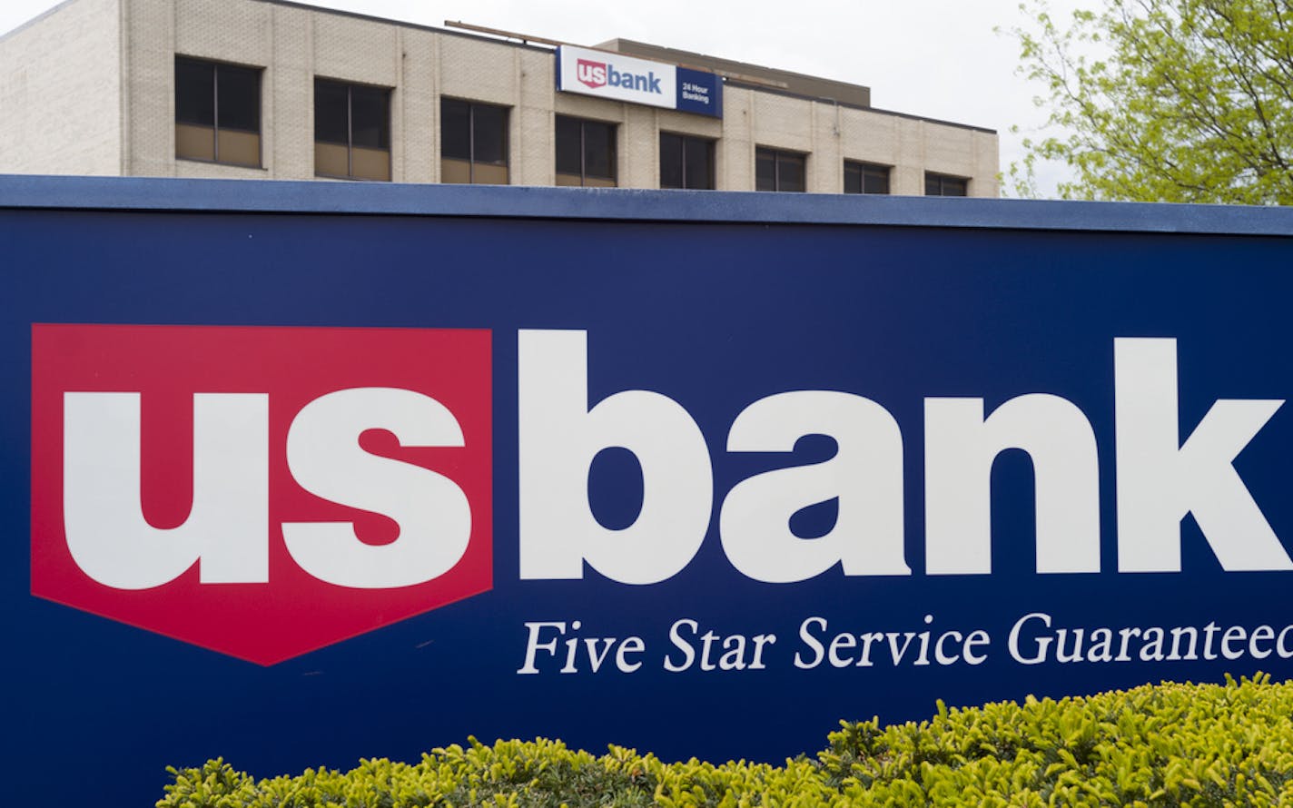 This Wednesday, May 3, 2017, photo shows a U.S. Bank branch in Omaha, Neb. Dozens of companies, including US Bancorp., have announced they are giving their employees bonuses, following the passage of the Republican tax plan that President Donald Trump signed into law in December. (AP Photo/Nati Harnik)