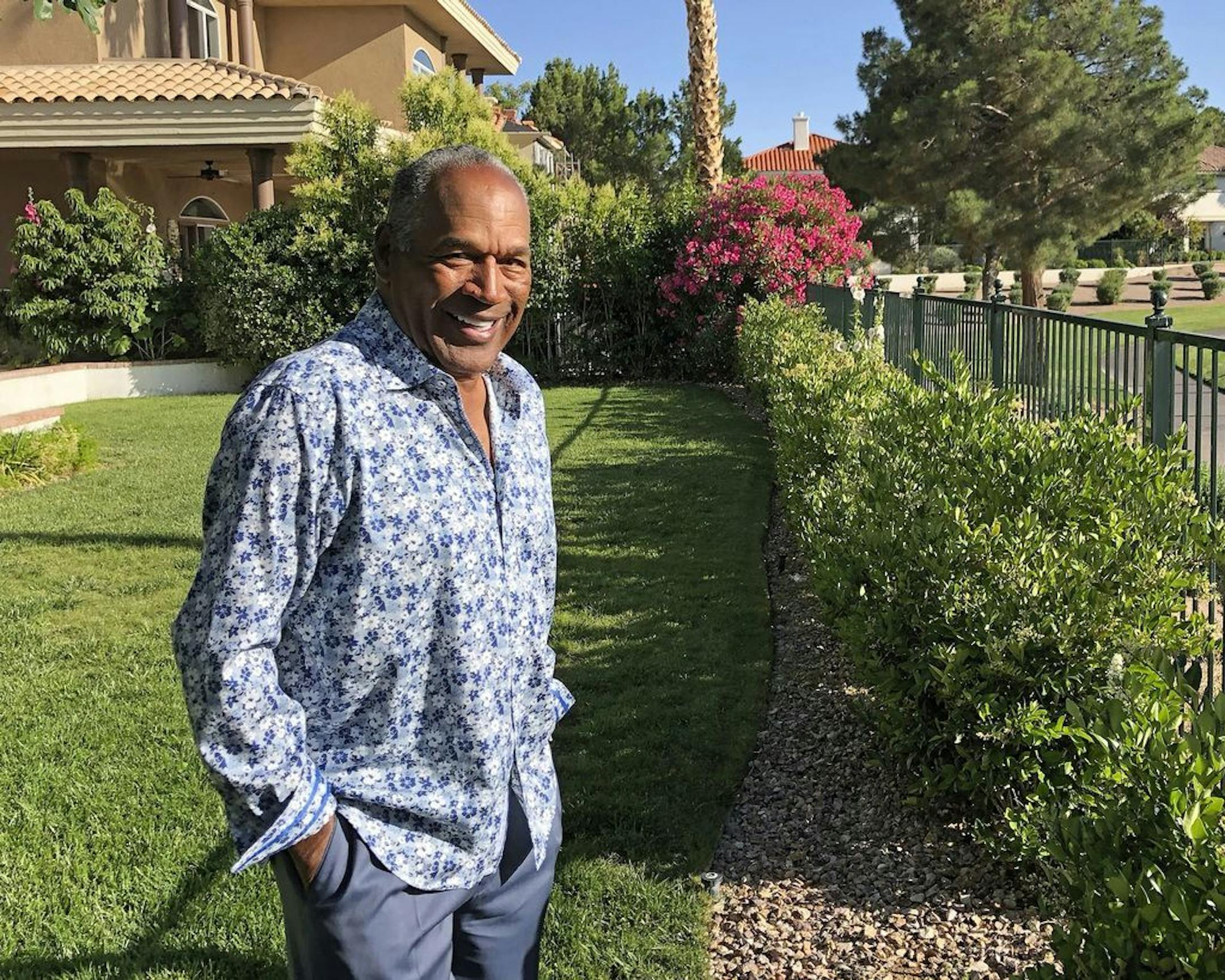 This photo provided by Didier J. Fabien shows O.J. Simpson in the garden of his Las Vegas area home on Monday, June 3, 2019. After 25 years living under the shadow of one of the nation's most notorious murder cases, Simpson says his life now is fine.