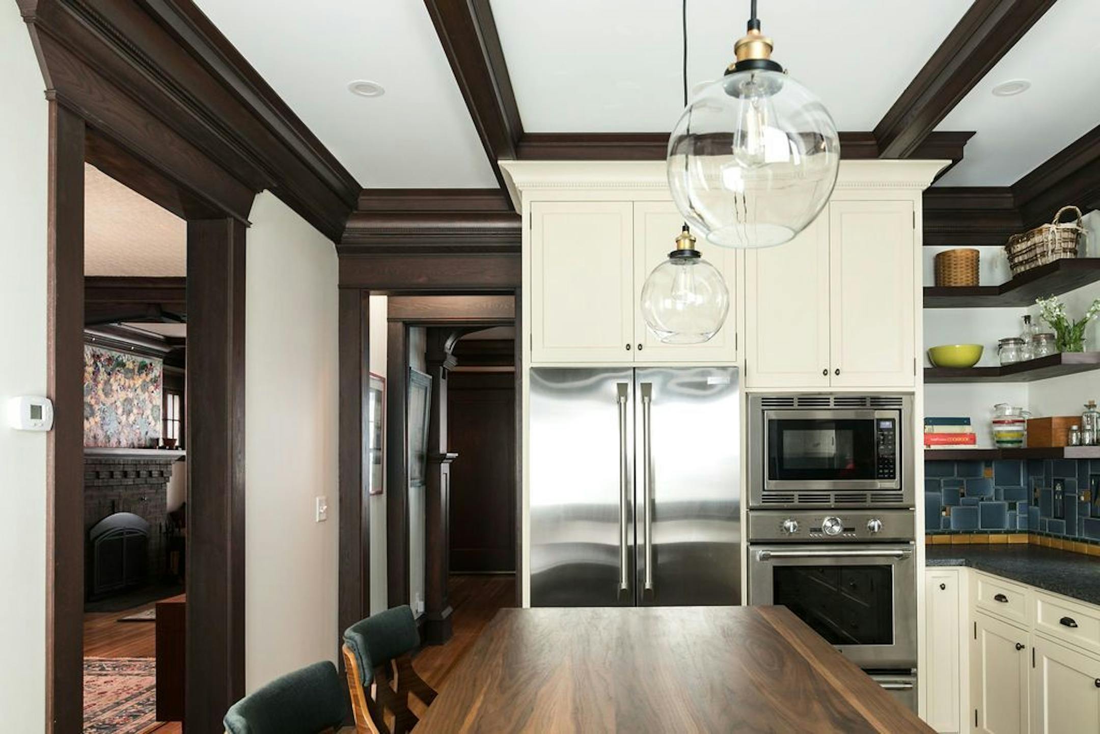 Beams and cabinetry details mimic those found elsewhere in the house.