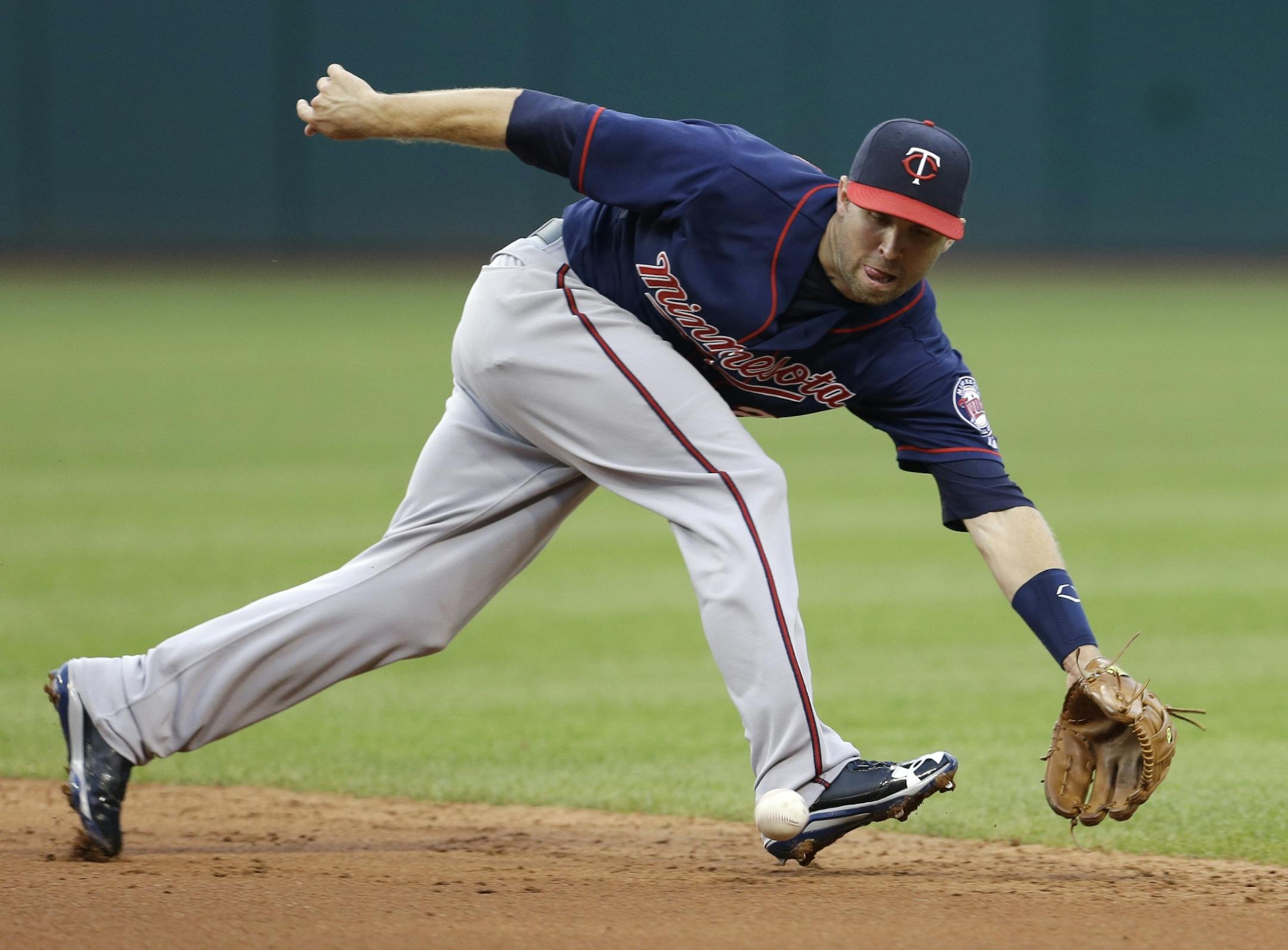 The Twins' Brian Dozier tracked down a grounder hit by the Indians' Mike Aviles in the fifth inning of Cleveland's 5-1 victory Friday.