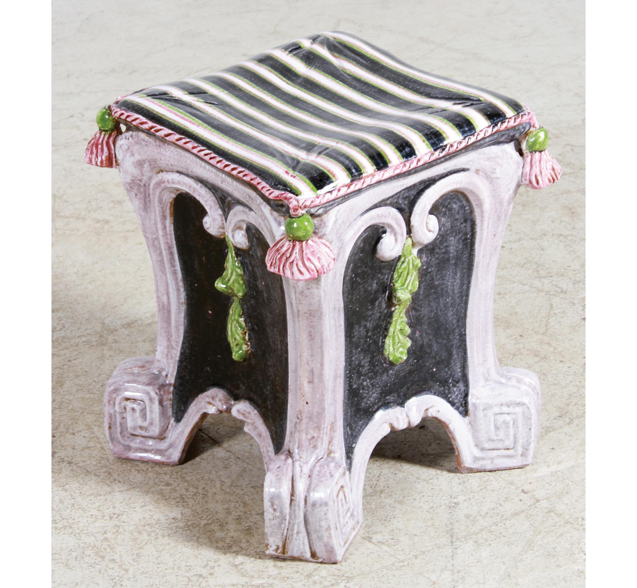 This majolica stool was made in the 20th century. It is square instead of the antique barrel shape, but still shows the influence of 19th-century style.