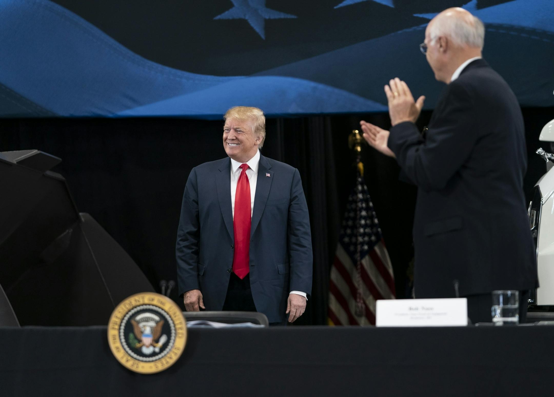 President Donald J. Trump walked out to an applause at Nuss Truck and Equipment in Burnsville for a roundtable discussion on tax cuts and the U.S. economy in Burnsville, Minn., on Monday, April 15, 2019. At right is the president of Nuss Truck and Equipment Bob Nuss.