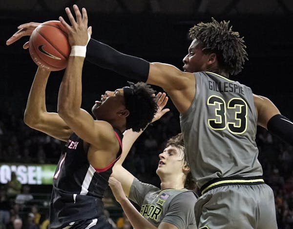 Baylor's Freddie Gillespie (33) blocks a shot by Texas Tech's Terrence Shannon Jr. (1) during the second half of an NCAA college basketball game in Wa