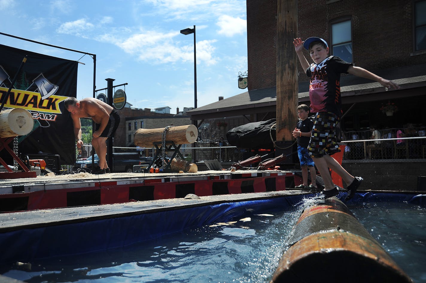 In this 2011 file photo, Jordan Cummings, right, practiced log-rolling while his father Geno Cummings, left, cleaned up at Lumberjack Days in Stillwater.