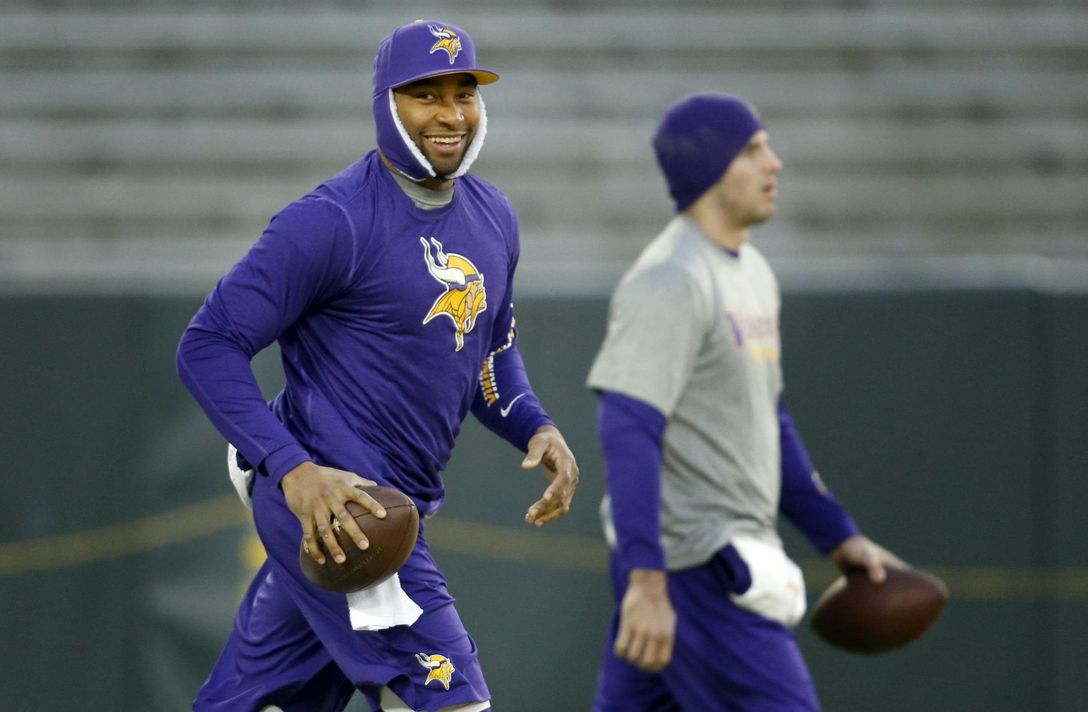Minnesota Vikings quarterbacks Joe Webb and Christian Ponder walked out on the field for early pregame warm ups at Lambeau Field.