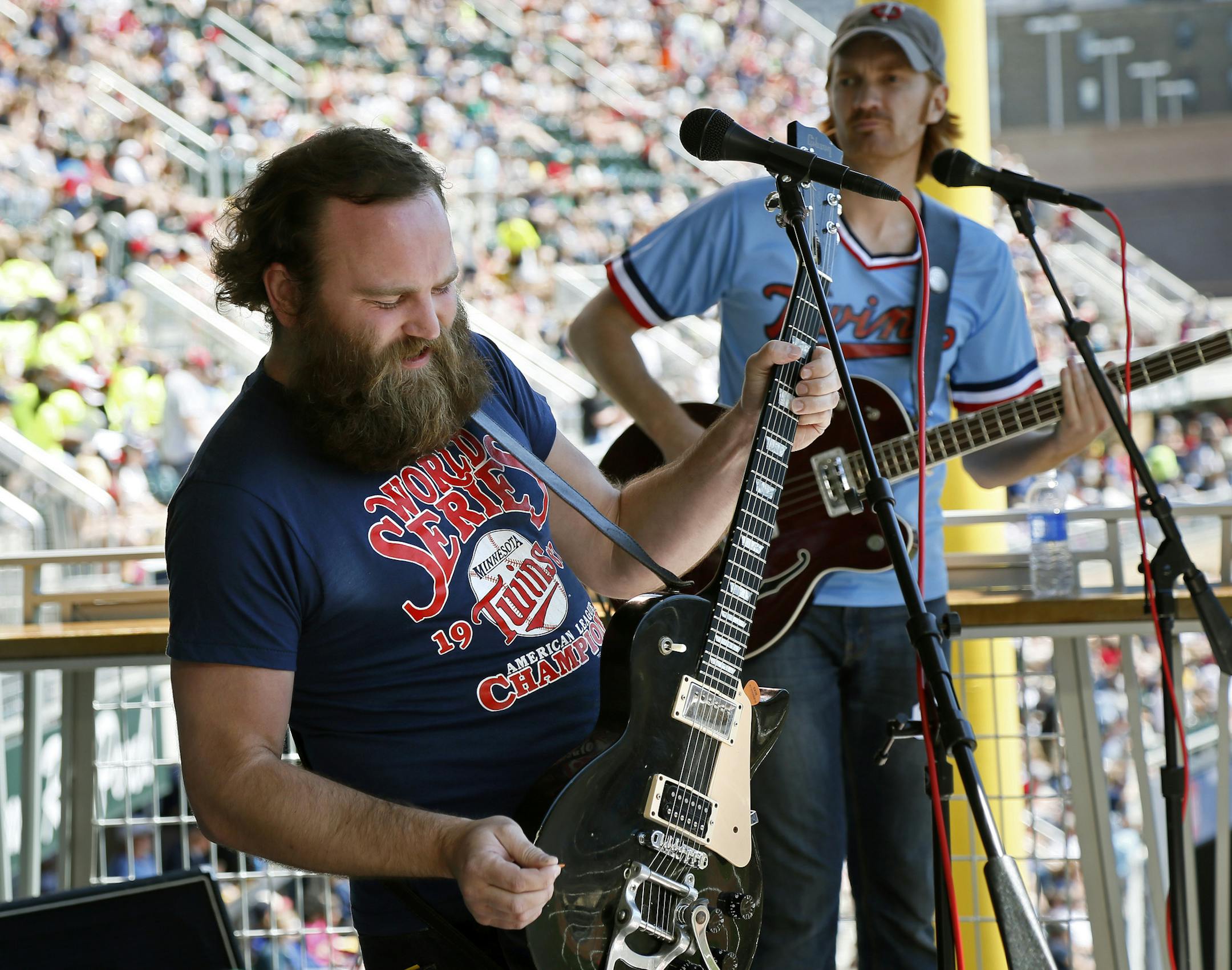 Singer/guitarist Gabriel Douglas and bassist Chris Holm of the 4onthefloor both donned Twins shirts for Wednesday's gig at Target Field, which included short performances between innings at the Twins-White Sox game.