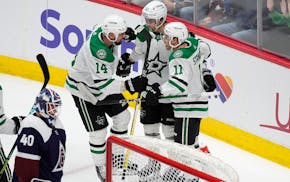 From left, Stars left wing Jamie Benn congratulates center Wyatt Johnston after his goal along with center Logan Stankoven in the third period Sunday
