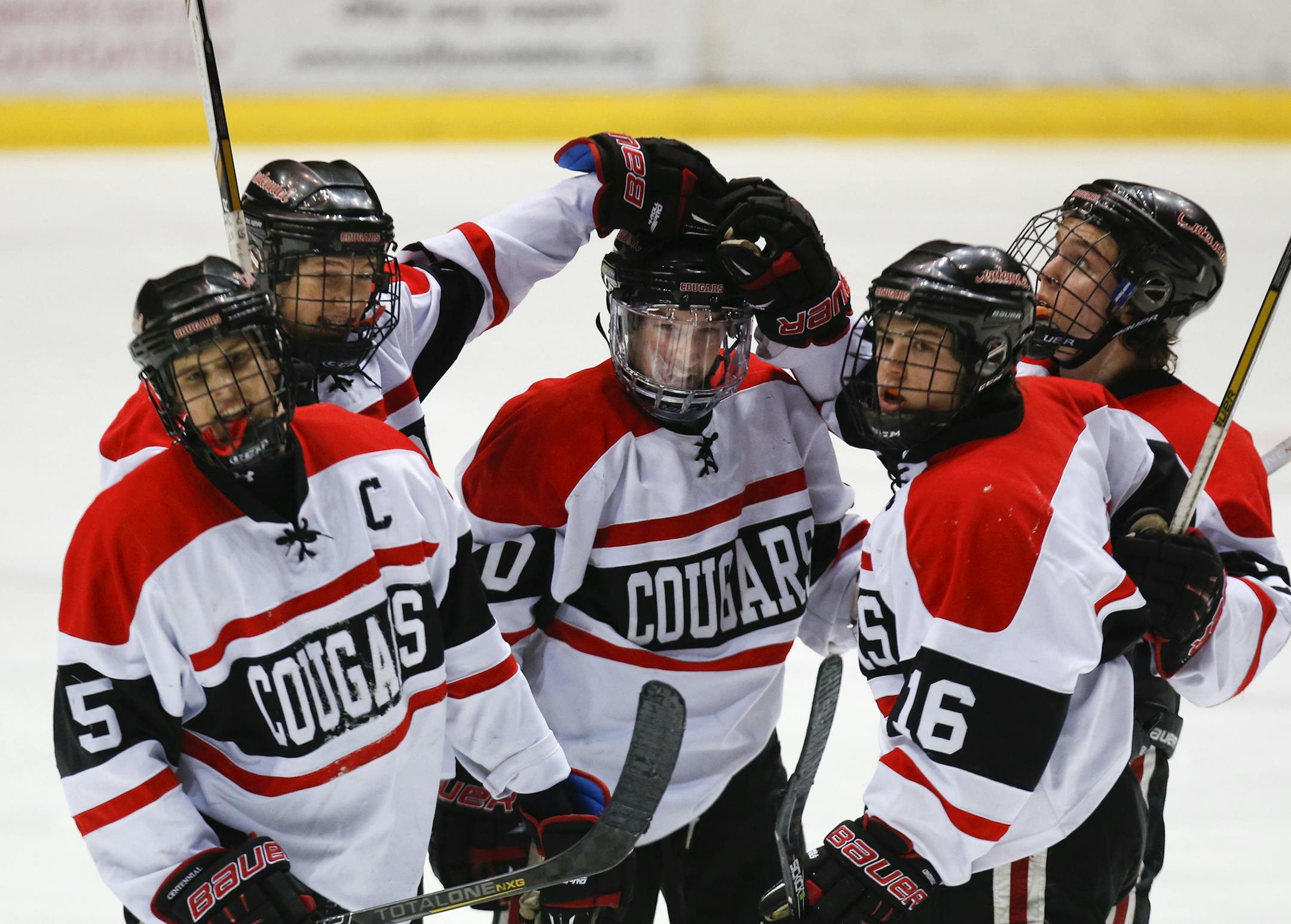 Centennial's Ryner Gorowski, center, celebrates his second goal and game winner with teammates against Champlin Park during Centennial's 4-2 win in boys' hockey tournament section 5 finals Friday, March 1, 2013, at the State Fairgrounds Coliseum in St. Paul, MN.] (DAVID JOLES/STARTRIBUNE)boys' hockey tournament section 5 finals Friday, March 1, 2013, at the State Fairgrounds Coliseum in St. Paul, MN.**Ryner Gorowski,cq