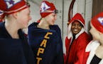 Suhan Mohamed, in red jacket, chatted with her teammates, from the left, Bethany Kanopp, Rachel Warner and Kaylie Stroeing as they prepared to partici
