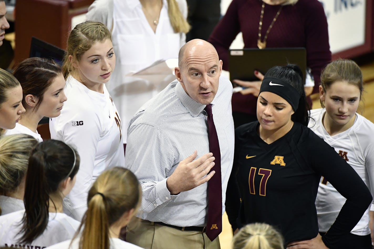 Gophers volleyball coach Hugh McCutcheon with his team on Nov. 23, a week before his extension was signed.