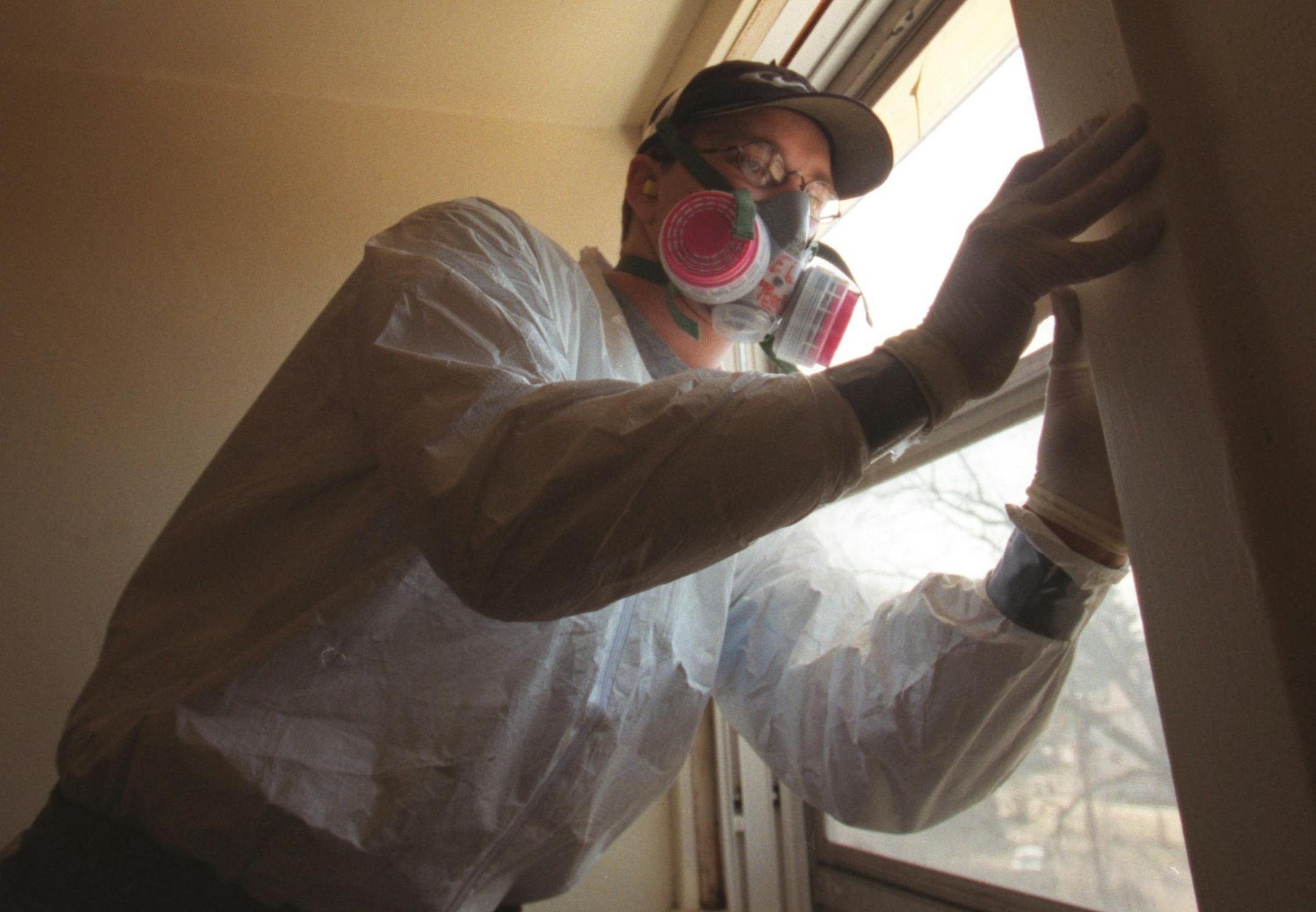 St. Paul, MN., Wednesday, 3/29/2000. Travis Thompson of Blue Earth, a CLEARCorps lead removal crew member installed the last of twleve new windows in a house near downtown St. Paul. The windows were removed and replaced as part of the effort to reduce the risk of childhood lead poisioning. CLEARCorps is a nonprofit lead removal company, part of the AmeriCorps national service network. LEAD31 All children up to age 6 living in Minneapolis and St. Paul should be tested for exposure to lead, state