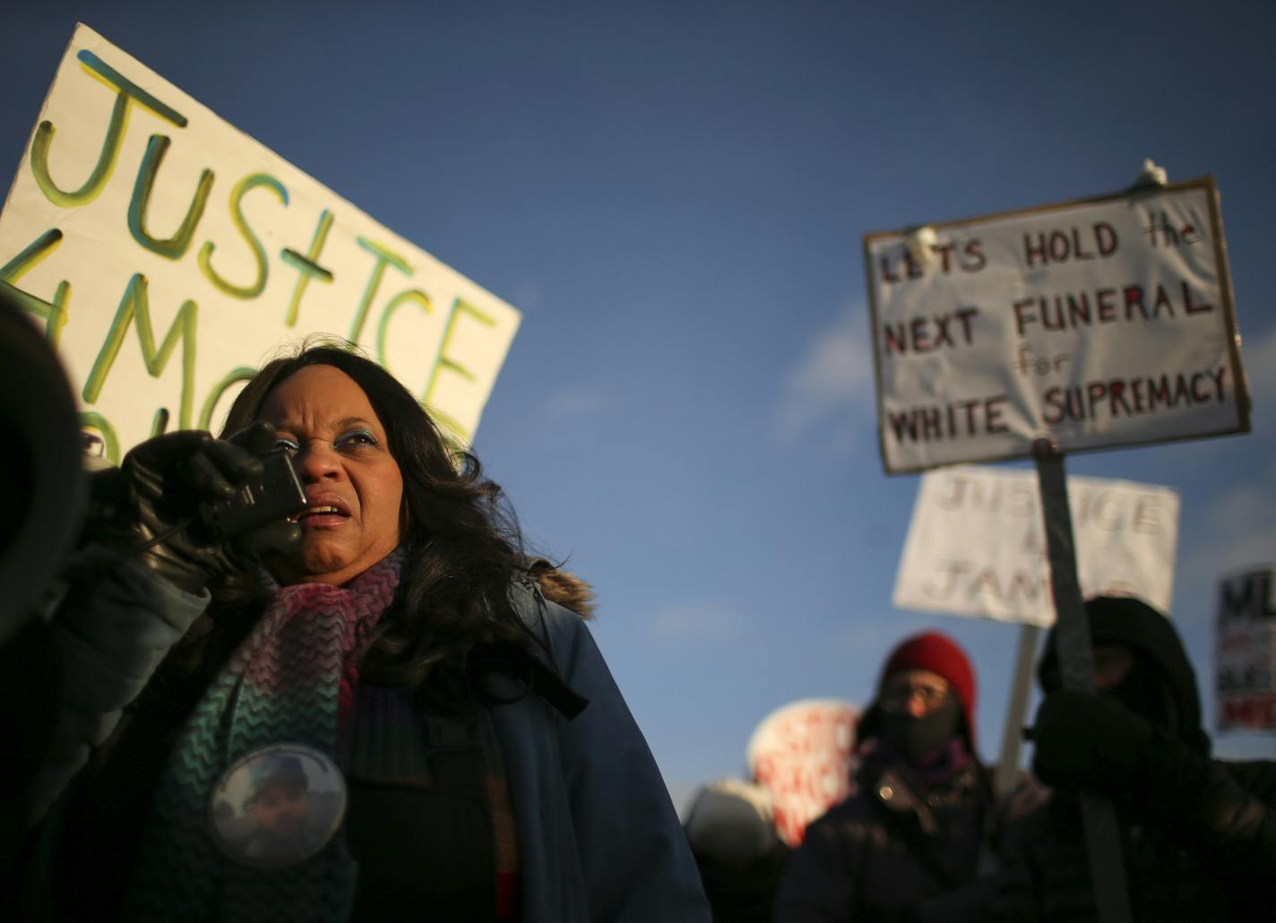 Marcus Golden's mother, Ericka Cullars-Golden addressed the demonstrators gathered in the middle of the Lake St. bridge Monday afternoon. ] JEFF WHEELER &#xef; jeff.wheeler@startribune.com About 75 demonstrators organized by the Twin Cities Coalition for Justice 4 Jamar participated an MLK Day "Tale of Two Cities" march Monday afternoon, January 18, 2016 to demand that Marcus Golden's case in St. Paul be reopened and that Hennepin County Attorney Mike Freeman bypass a grand jury to prosecute off