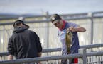 Daniel Belous, 15, held up a smallmouth bass he'd just caught at the Rum River Dam from the in Anoka Wednesday afternoon. He was released it after mea