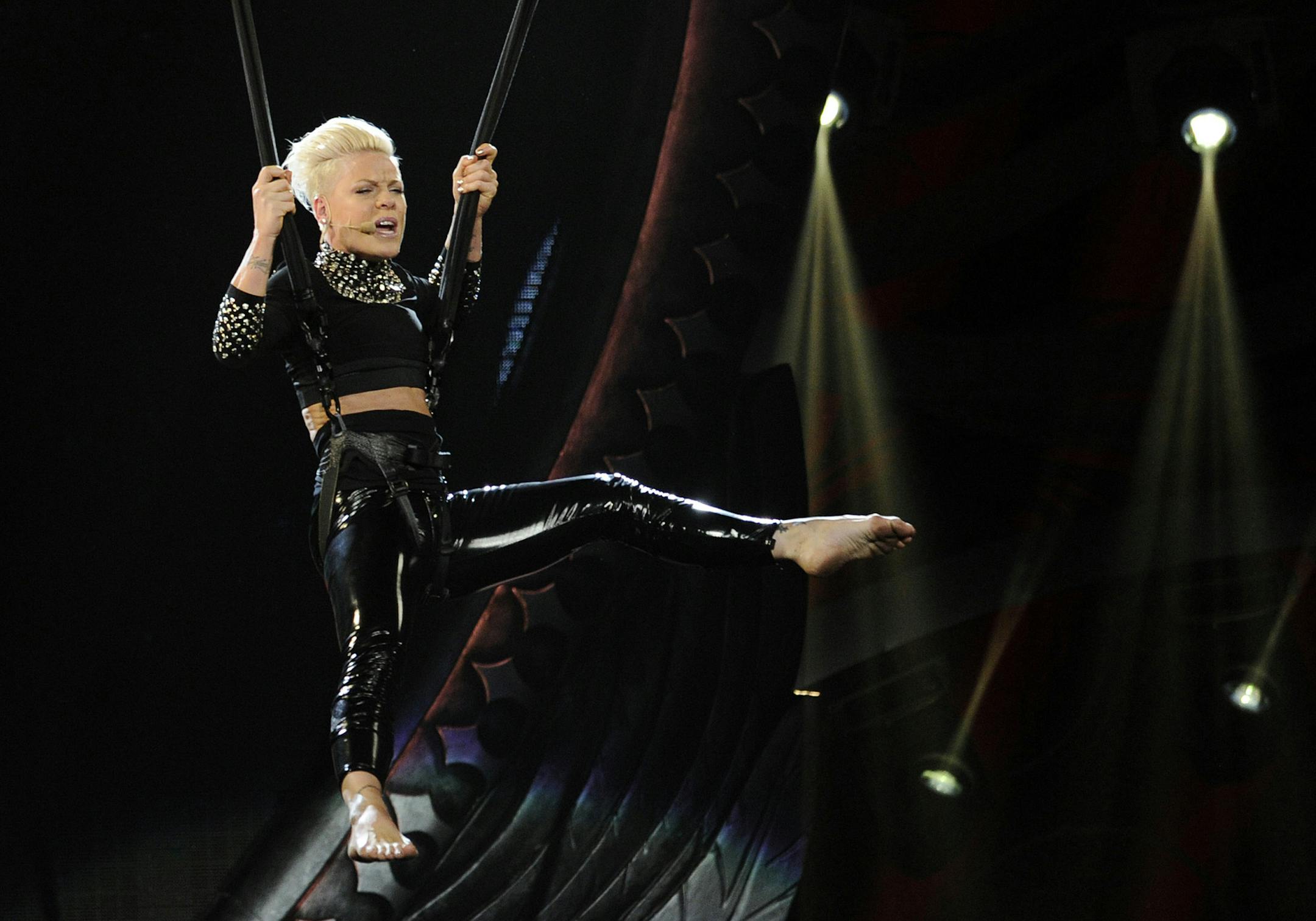 Pink performs at the Staples Center on Saturday, Feb. 16, 2013 in Los Angeles. (Photo by Chris Pizzello/Invision/AP) ORG XMIT: MIN2013031114452156