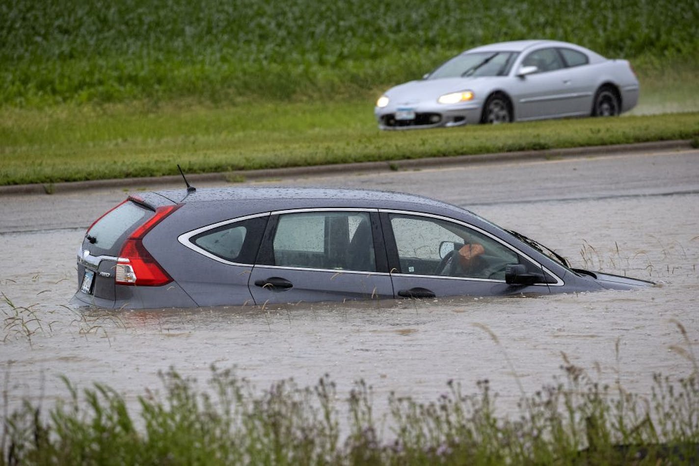 Roads were closed near the intersections of Cedar Avenue and Dodd Road in Lakeville due to flooding Monday.