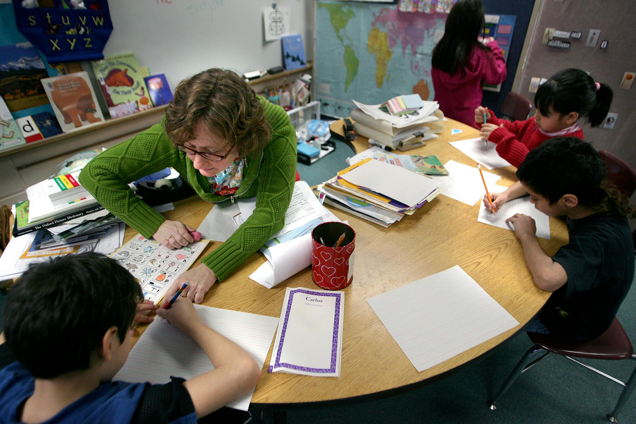 ELIZABETH FLORES � eflores@startribune.com January 17, 2008 - Inver Grove Heights, MN - Pine Bend Elementary ESL teacher, Natasha Bade, worked with students from left, Pedro Ortiz-Palacio, Alexis Cruz-Hernandez, Mariana Chavez, and Jaqueline Ortiz-Palacio, during a special class to help the mostly Native Spanish speakers. �A mobile home park in Inver Grove Heights is starting to transform one of the district's elementary schools. At Pine Bend Elementary, seven non-native English speakers have en