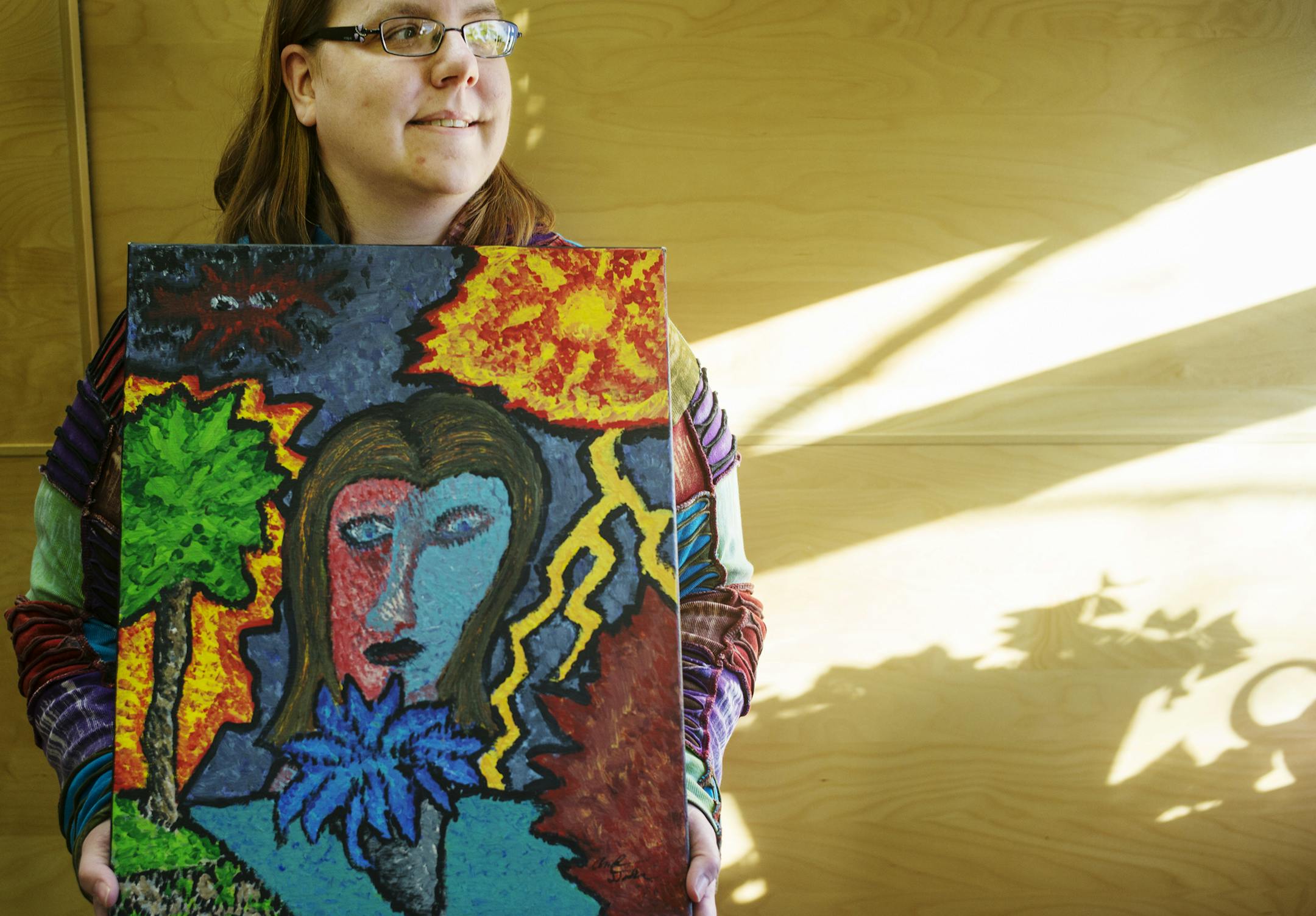 Amber Dalhman, 31, loves Vail Place where one of her paintings describing the throes of of her bipolar condition hangs in the office area.] Richard Tsong-Taatarii/rtsong-taatarii@startribune.com