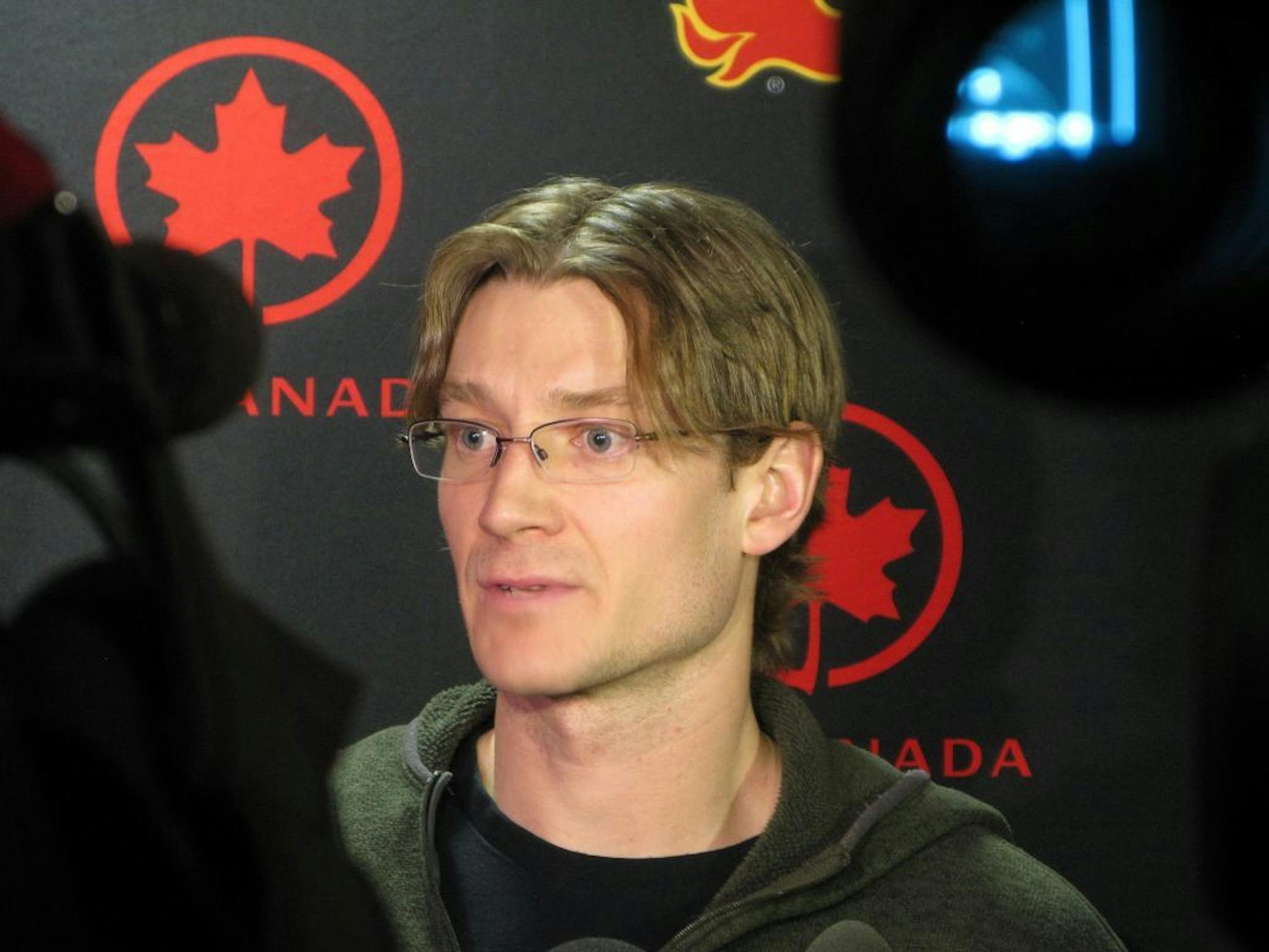 Defenseman Jay Bouwmeester speaks to reporters during an NHL hockey news conference in Calgary, Alberta. on Tuesday, April 2, 2013. The Calgary Flames continued to usher big names out the door with the trade of Bouwmeester to the St. Louis Blues on Monday.