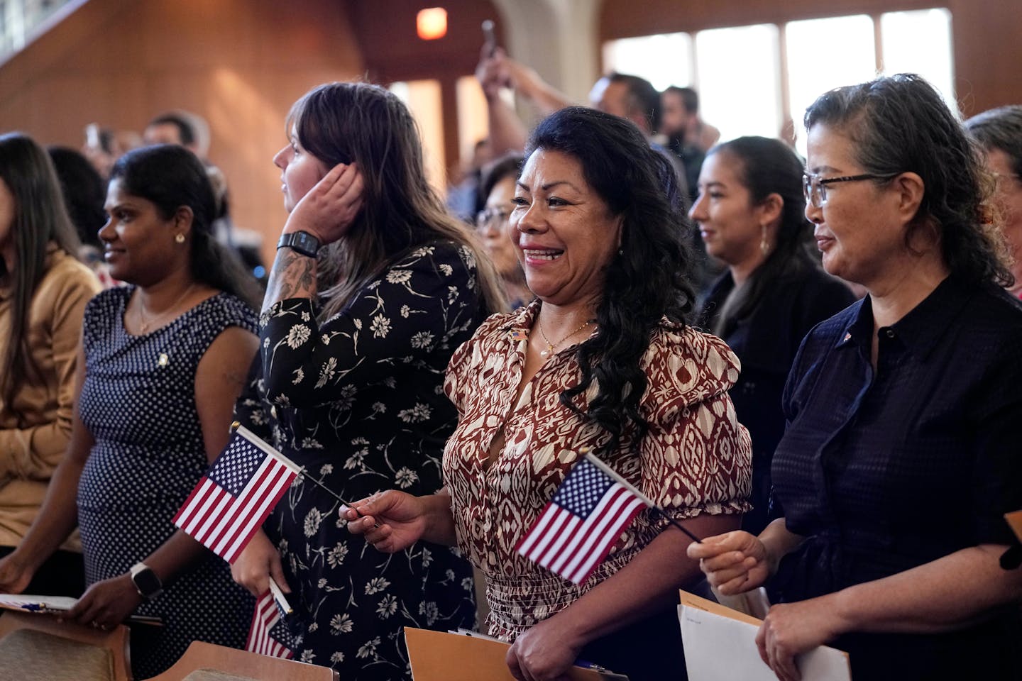 Women representing more than 20 countries take part in a Naturalization Ceremony, March 8, 2024, in San Antonio. More than half of the foreign-born po