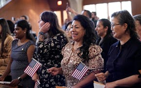 Women representing more than 20 countries take part in a Naturalization Ceremony, March 8, 2024, in San Antonio. More than half of the foreign-born po