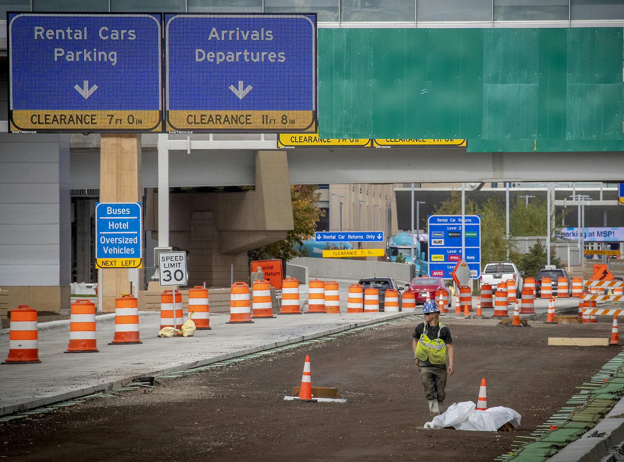 Workers worked along Glumack Drive, likely one of the busiest thoroughfares in the state, Monday, September 28, 2020 in Bloomington, MN. The quarter-mile roadway feeds into the Minneapolis-St. Paul International Airport and was in dire need of repair. Now, through an odd quirk of fate -- the global pandemic -- the road is being overhauled with minimual disruption because air travel has plunged and workers can proceed with the project largely unimpeded. ] ELIZABETH FLORES • liz.flores@startribune