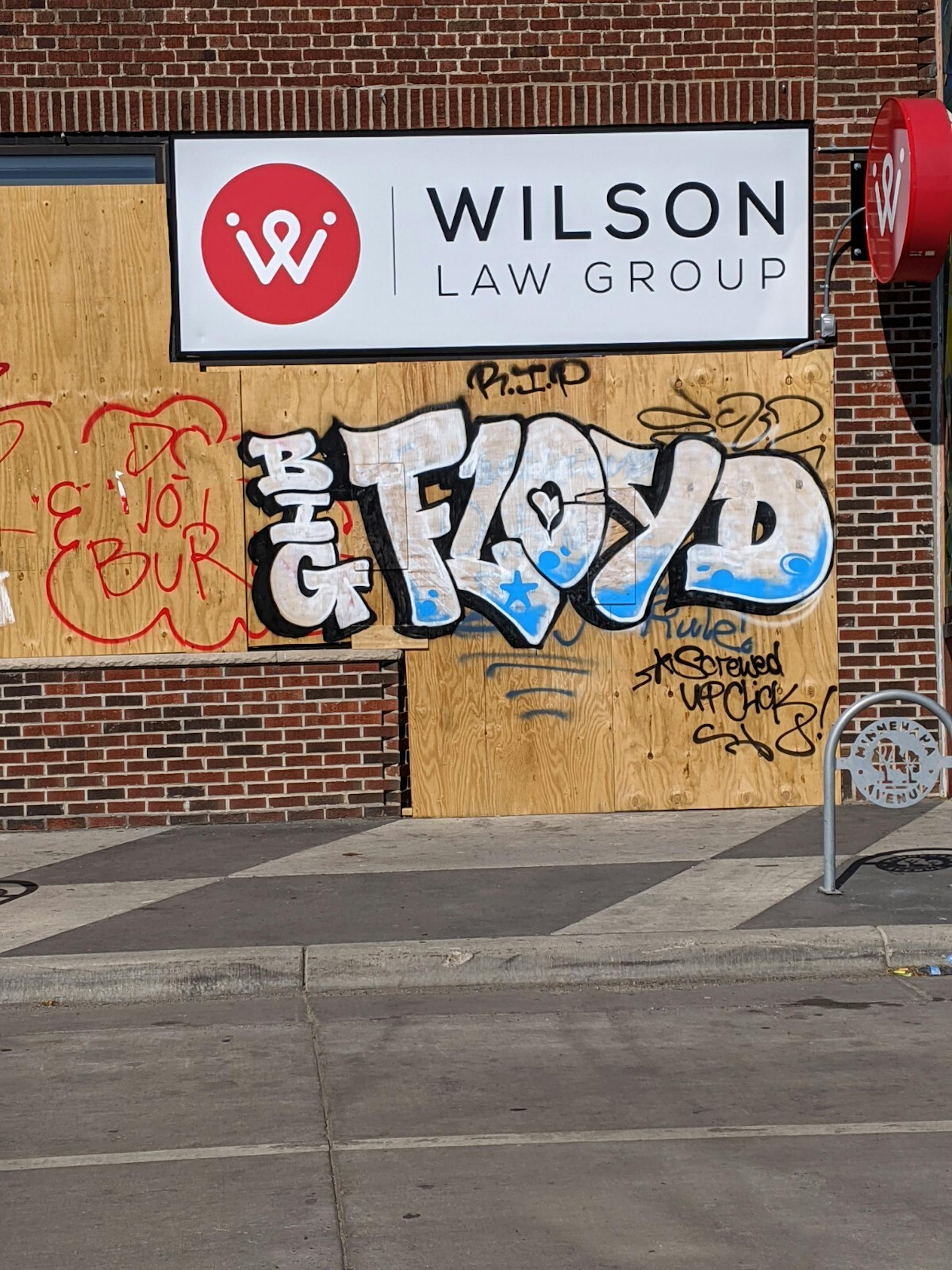 The boards over Wilson Law Group at 3019 Minnehaha Ave. show support for George Floyd, whose death by police sparked a worldwide movement to end the killing of black people by police.