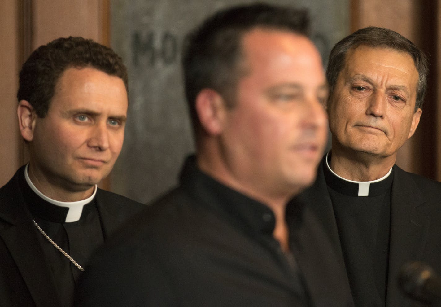 Abuse survivors Jim Keenan spoke of the importance of this historic agreement, as Bishop Andrew Cozzens (left) and Vicar General Rev. Charles Lachowitzer (right) listen. ] Twin Cities Archdiocese Vicar General, Rev. Charles Lachowitzer said, church officials would work with St. Paul attorney Jeff Anderson to implement the terms of a settlement of a landmark clergy sex abuse lawsuit. &#x201a;&#xc4;&#xfa;We&#x201a;&#xc4;&#xf4;ve forged a new way,&#x201a;&#xc4;&#xf9; Anderson said at the news confe