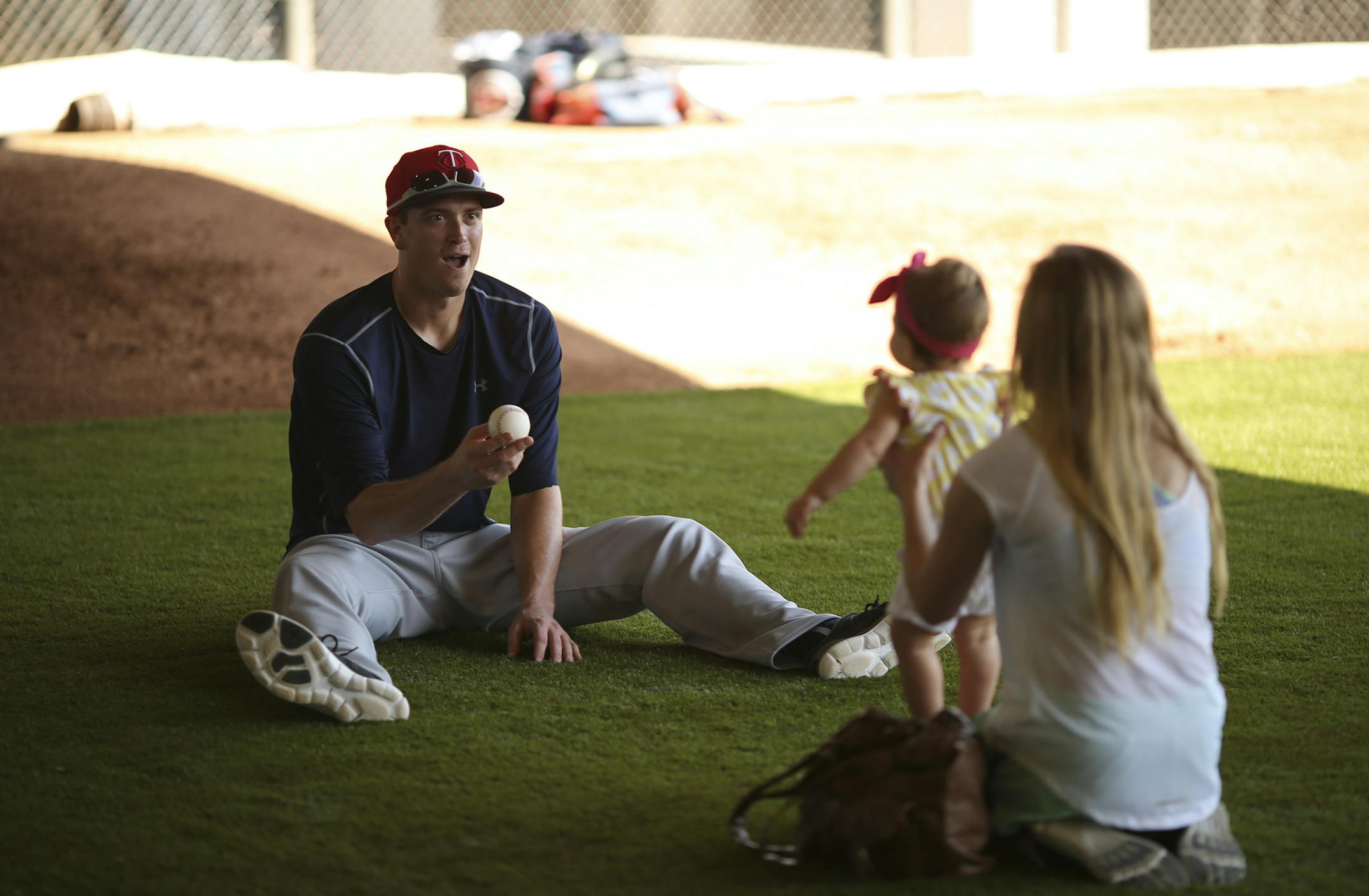 Twins pitcher Kyle Gibson played with his daughter, Hayden, with his wife, Elizabeth, in the bullpen after working out Tuesday morning at Hammond Stadium. ] JEFF WHEELER ï jeff.wheeler@startribune.com Twins pitchers and catchers continued their workouts Tuesday morning, February 24, 2015 at Hammond Stadium in Fort Myers, FL.