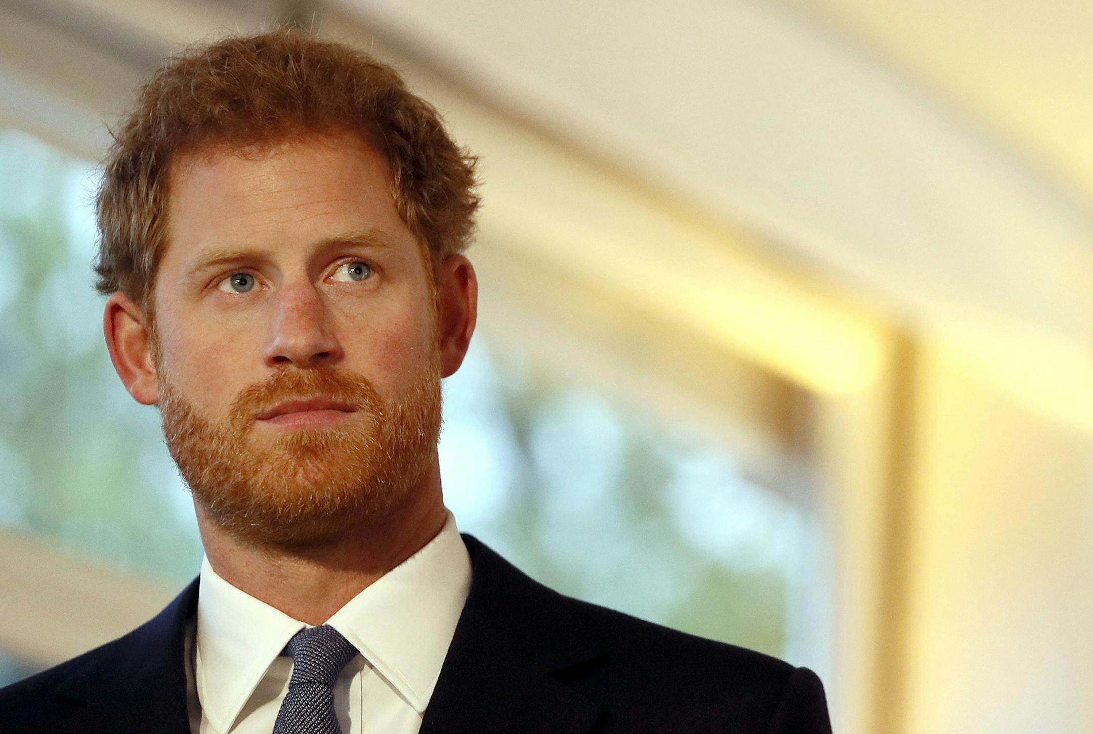 Britain's Prince Harry stands by a sign as he watches a short film at an International Mine Awareness Day reception at Kensington Palace in London, Tuesday, April 4, 2017. The world's two leading landmine charities, Mines Advisory Group (MAG) and The HALO Trust, held a reception on International Mine Awareness Day in order to galvanise support for their goal of a world free of landmines by 2025. (AP Photo/Kirsty Wigglesworth,pool) ORG XMIT: MIN2017041915260442