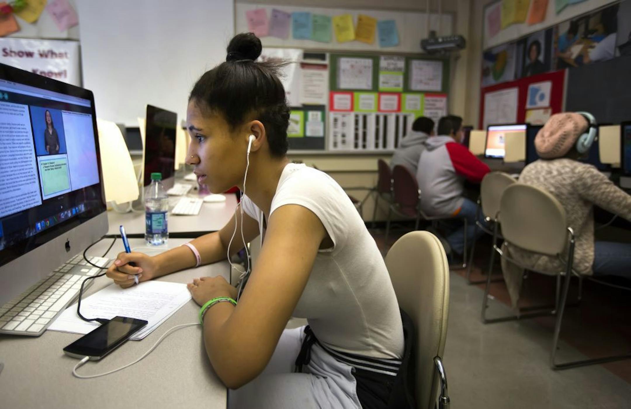 Nikkita Page, a senior at Patrick Henry High School, gets caught up on english Tuesday morning during winter break.