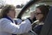 Pastor Christine Chiles put a cross on the forehead of Noreen Faulkner of Plymouth during a drive through service of Ash Wednesday March 1, 2017 in at