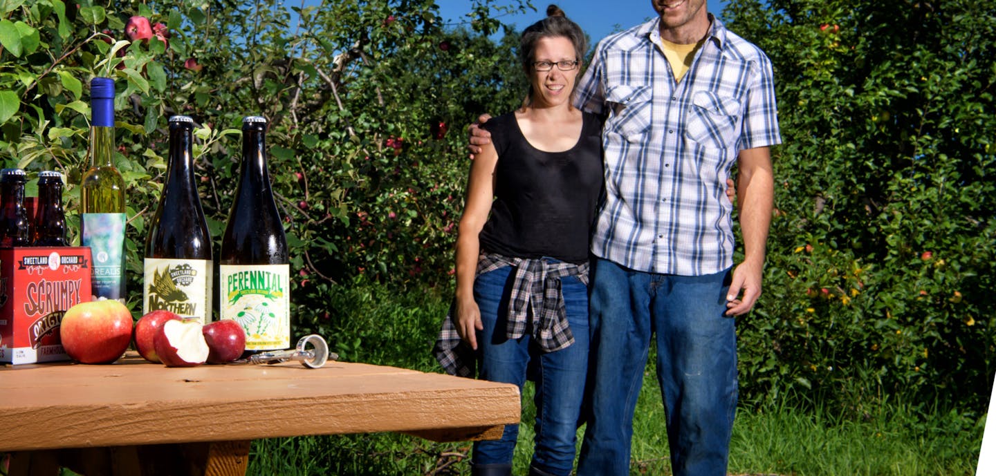 Gretchen and Mike Perbix of Sweetland Orchard with some of their fermented apple ciders. ] GLEN STUBBE &#xef; glen.stubbe@startribune.com Tuesday August 22, 2017 Photo(s) for the magazine's "drink" page. Gretchen and Mike Perbix own Sweetland Orchard and produce a range of beautiful fermented apple ciders. Can you shoot them, among the pretty trees, plus some close-ups of the cider looking drinkable, inviting, delicious.