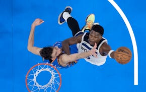 Chet Holmgren of the Thunder defends Anthony Edwards of the Timberwolves during Game 2 of the Western Conference finals on Thursday.