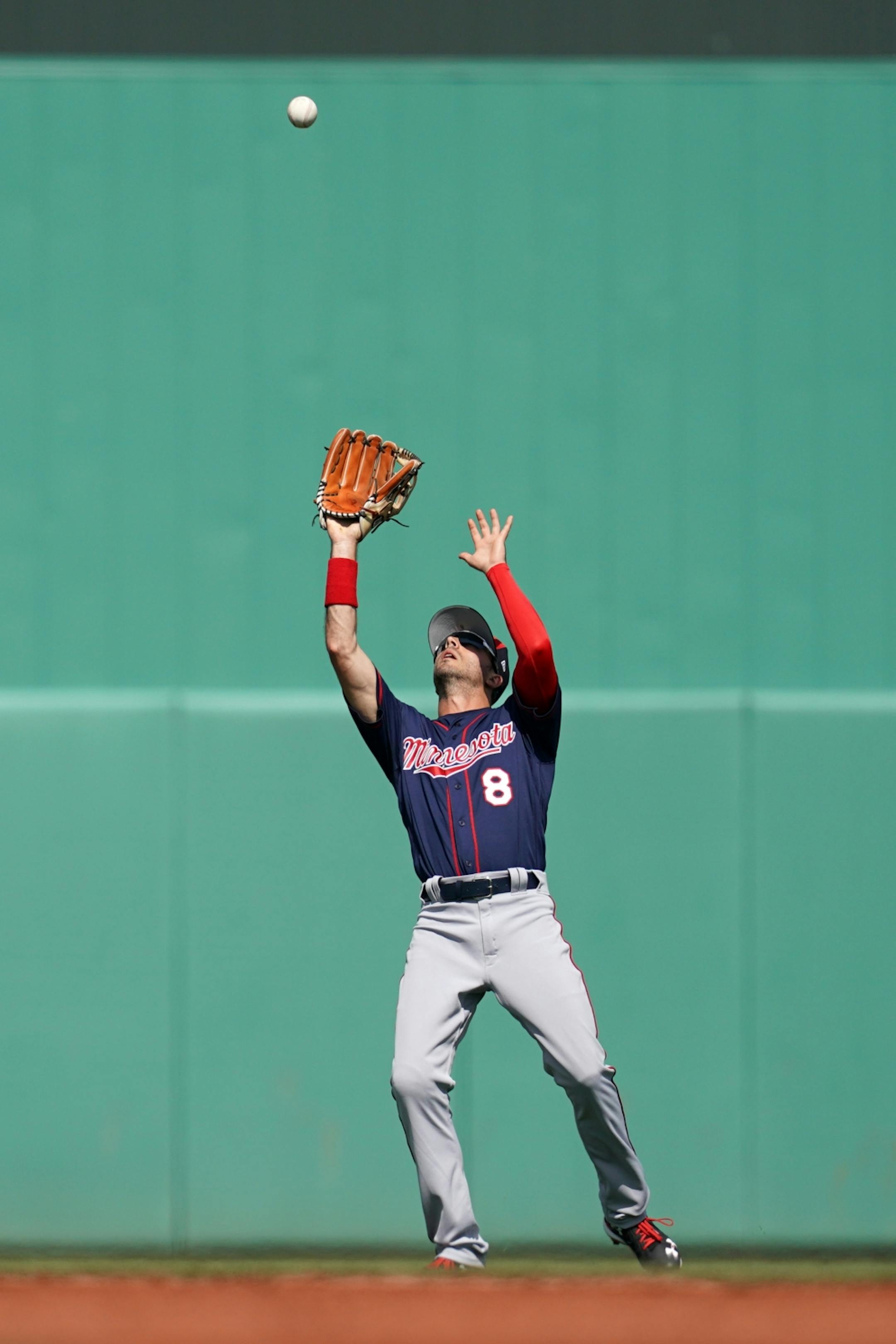 Minnesota Twins center fielder Zack Granite (8) reached up to field a pop fly during Sunday's game.