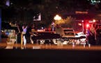 Bodies are removed from at the scene of a mass shooting, Sunday, Aug. 4, 2019, in Dayton, Ohio. Several people in Ohio have been killed in the second 