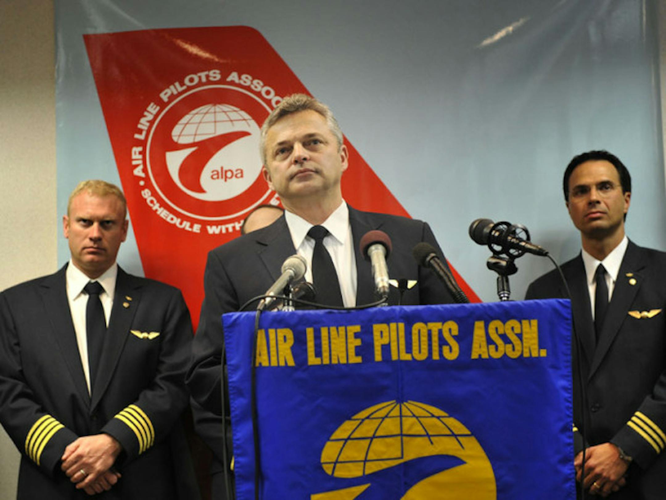 Dave Stevens, NWA pilots union chairman, said Tuesday: "Our pilots strongly oppose a merger as it now stands." He said they won't tolerate an unfair contract or support a merger that divides the two pilot groups. With him were union leaders John Haase, left, and Matt Coons.