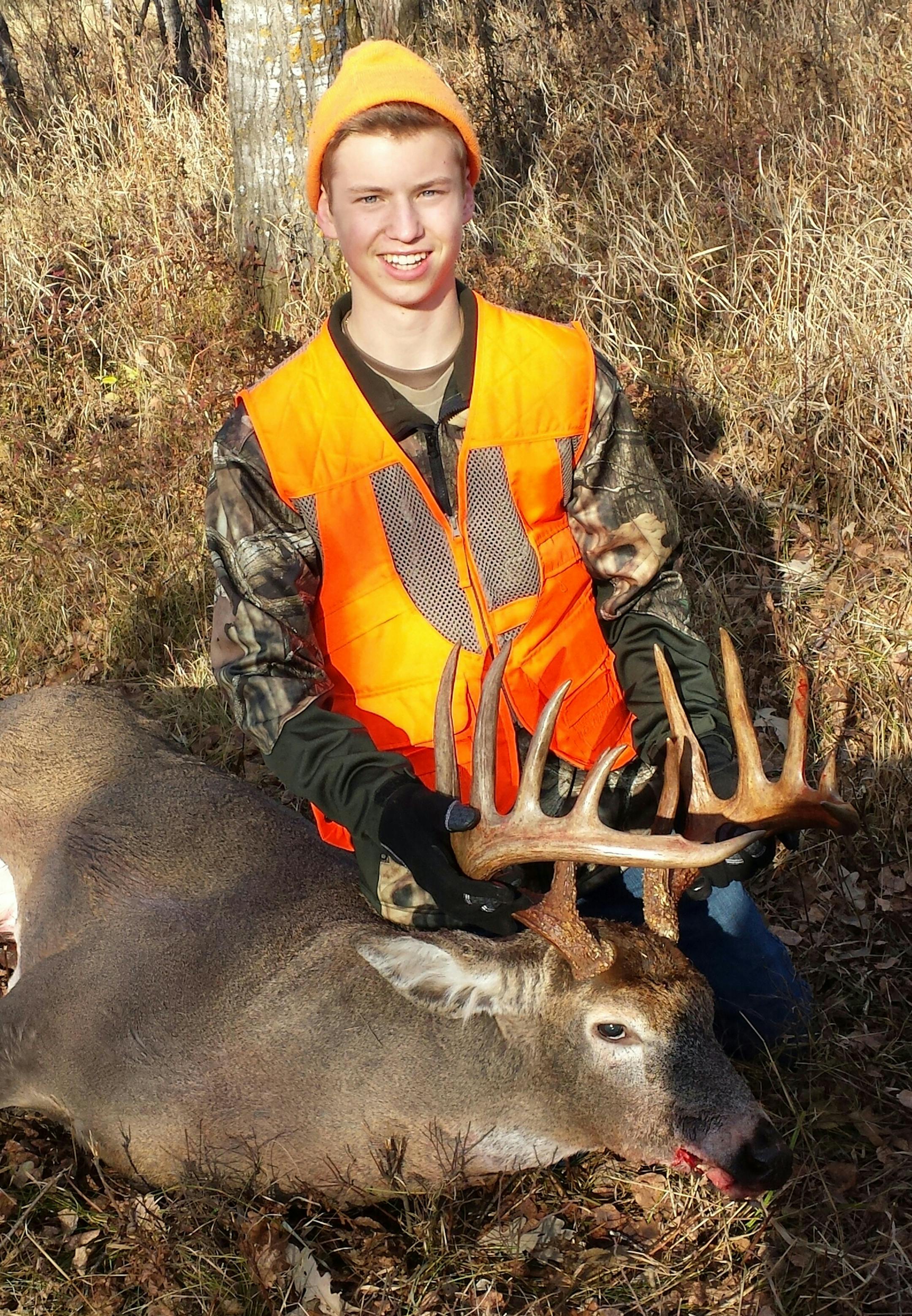 Jake Ramacier, 18, of Hugo, with a big buck he shot this year at deer camp.