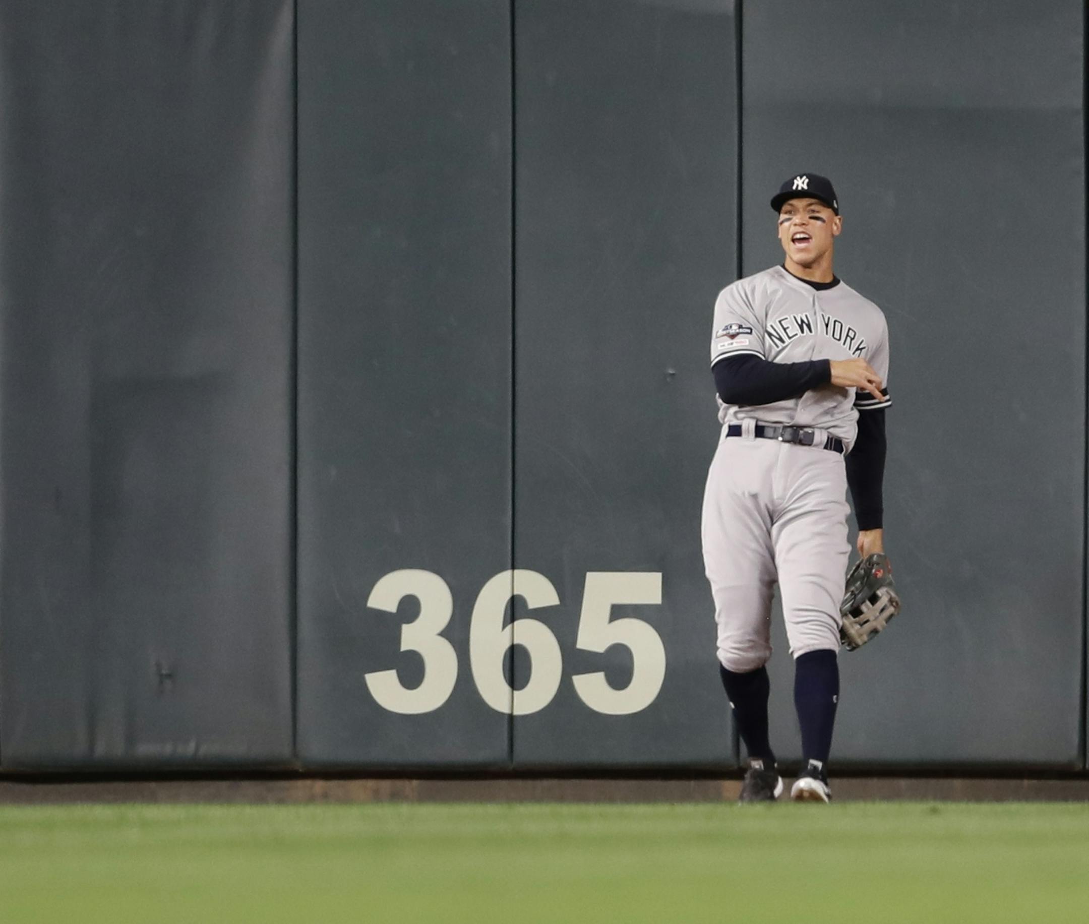New York Yankees right fielder Aaron Judge (99) celebrated after catching a Minnesota Twins third baseman Miguel Sano (22) fly ball in the sixth inning.