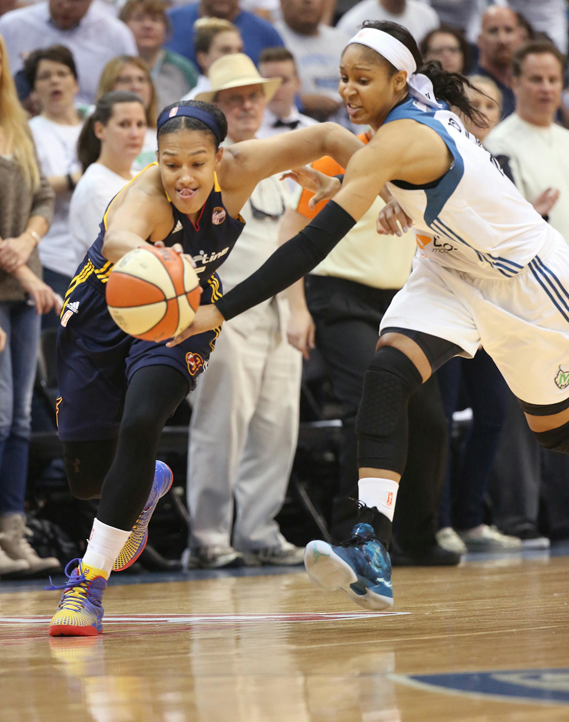 Indiana Fever guard Marissa Coleman (25) runs with the ball with Minnesota Lynx forward Maya Moore (23) in pursuit during the first quarter.