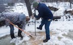 Working from memory and armed with shovels and picks, Minneapolis park keepers Jennifer Dennis and Ryan Susag have been working to clear drains packed