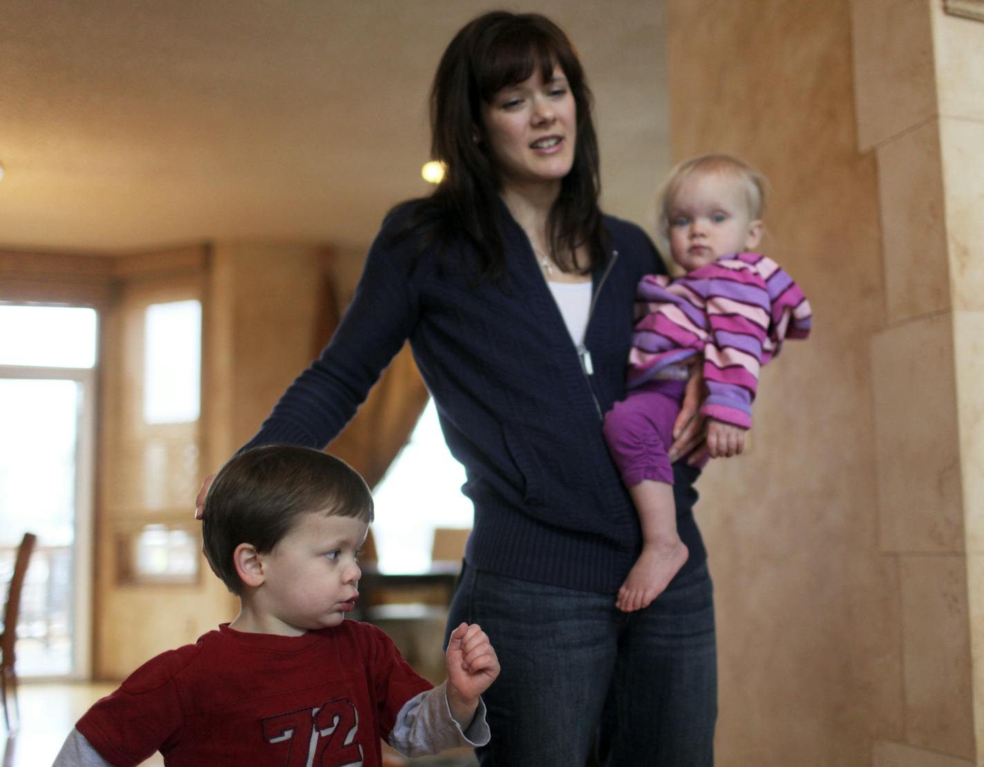 Caleb Slaven, 3, left, and his mom Julie holding Hannah, 21 months, Saturday, March 30, 2013, in Plymouth, MN.](DAVID JOLES/STARTRIBUNE) djoles@startribune.com A Plymouth couple sued Hennepin County Court, citing a lack of due process for parents accused of child abuse recently lost their case on appeal, but vow to continue a fight against procedures which they say don't allow parents to defend themselves before children are thrust into foster care.The Slavens were accused of child abuse after t